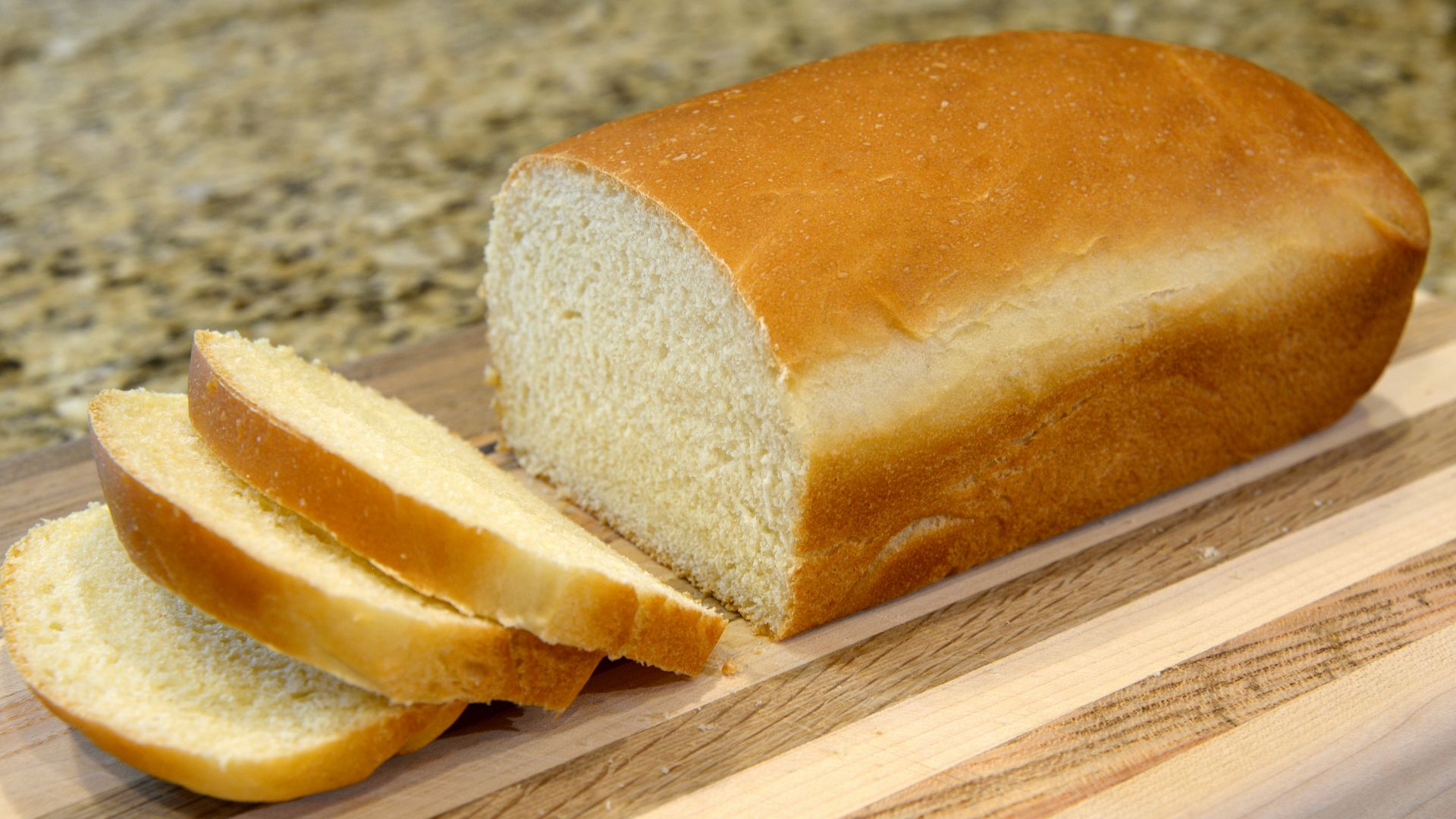 bread on brown wooden chopping board