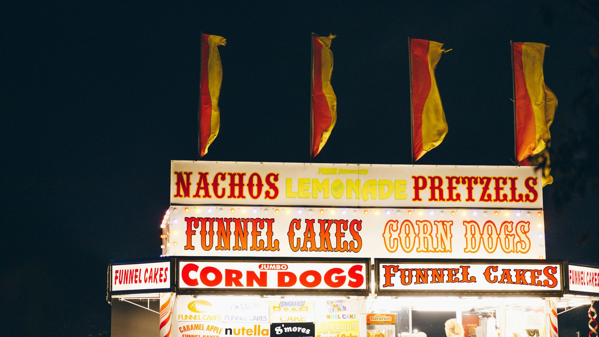 A food stand with a lot of food on top of it