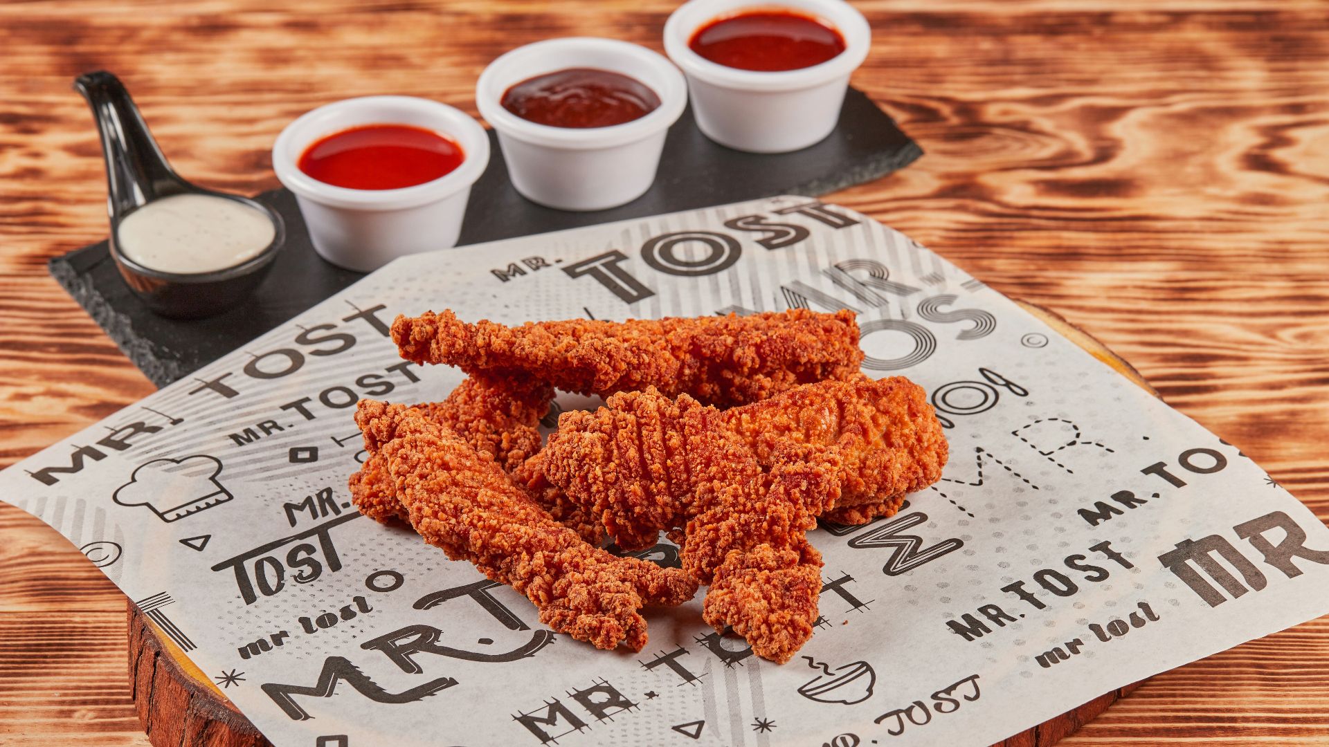 fried chicken on brown wooden chopping board
