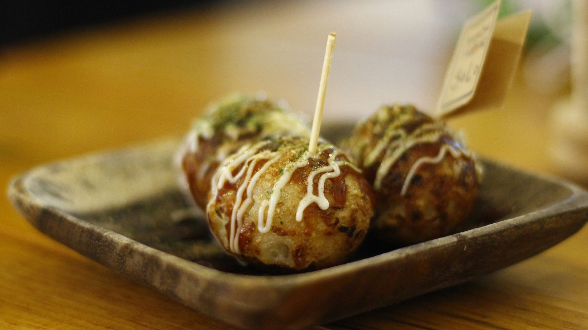 a wooden table with a plate of food on it