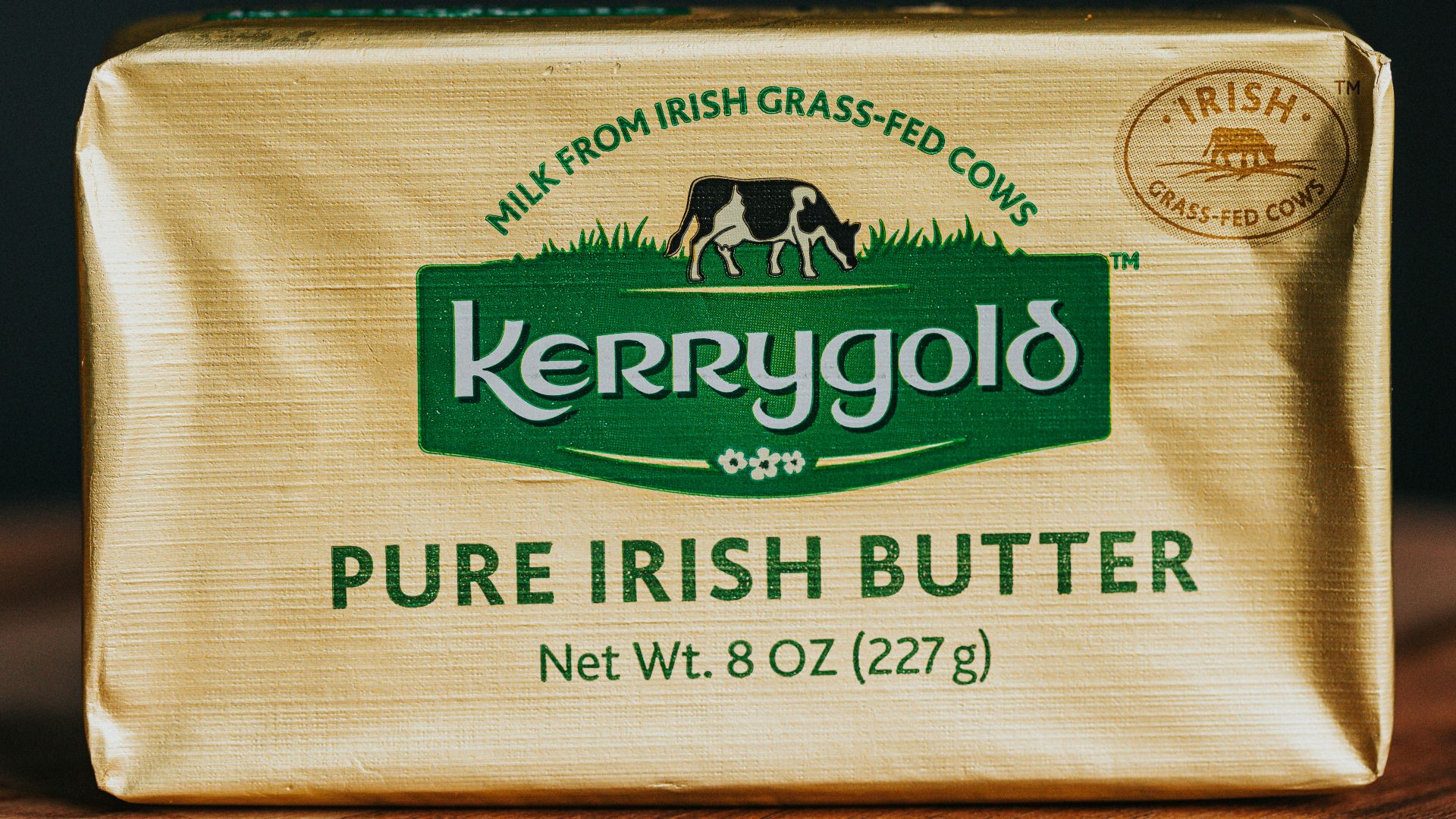 a bar of butter sitting on top of a wooden table