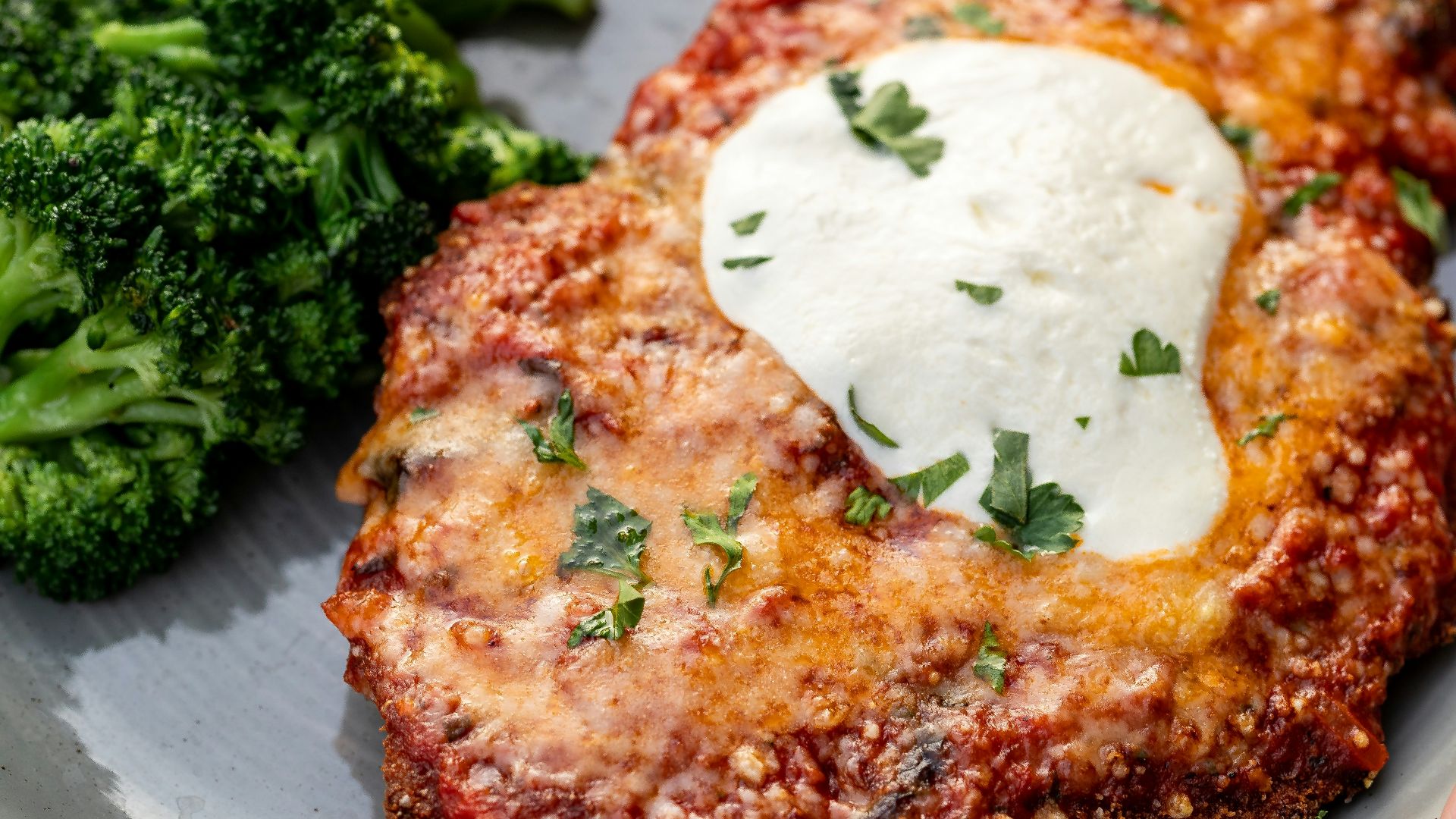 a plate of food with meat and broccoli
