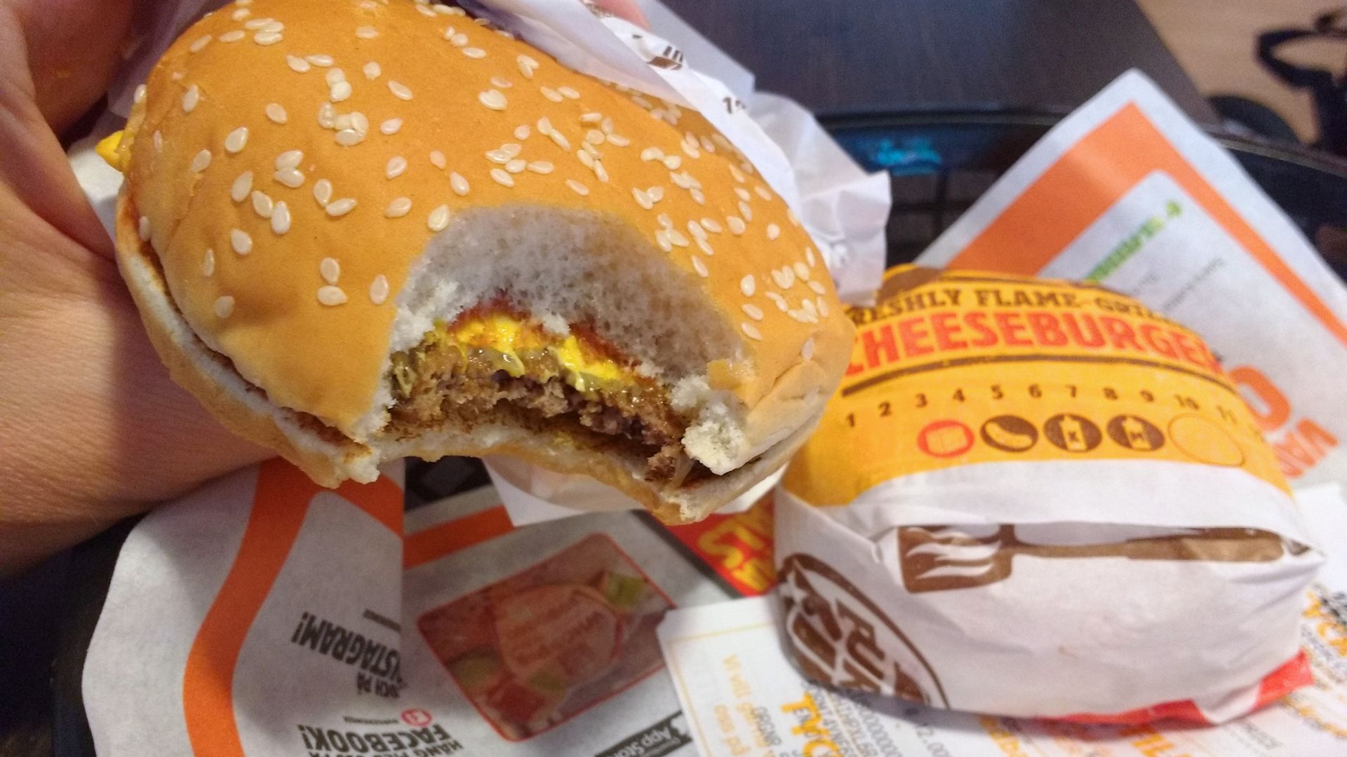 File:09 Burger King cheeseburger bite in Sweden - fast food cheeseburger in McDonald's restaurant.jpg