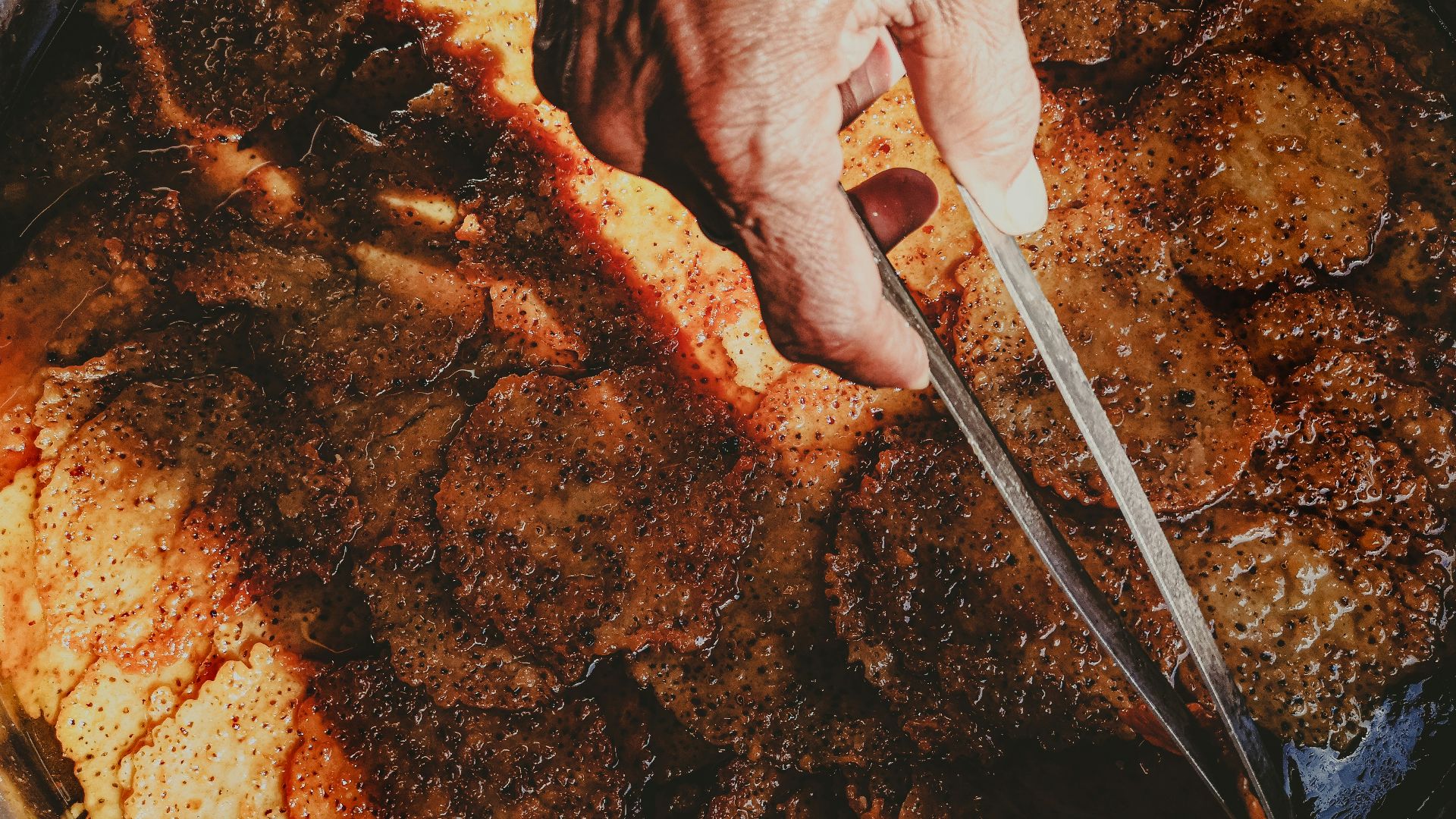 a person cooking food in a pan