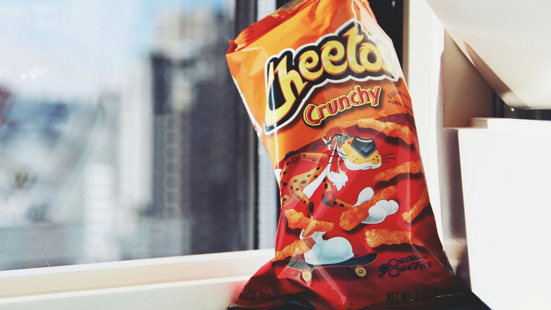 orange and yellow plastic pack on white table