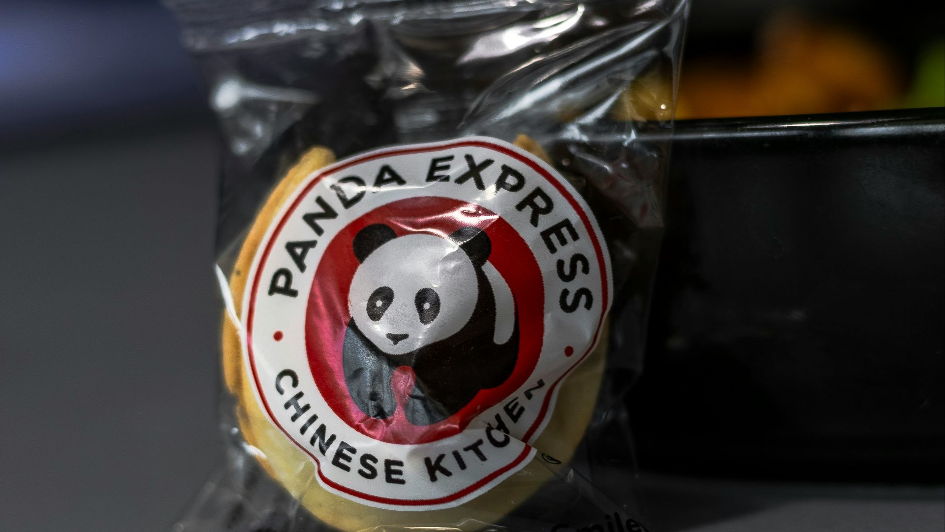 A bag of panda express chinese kits sitting on a table