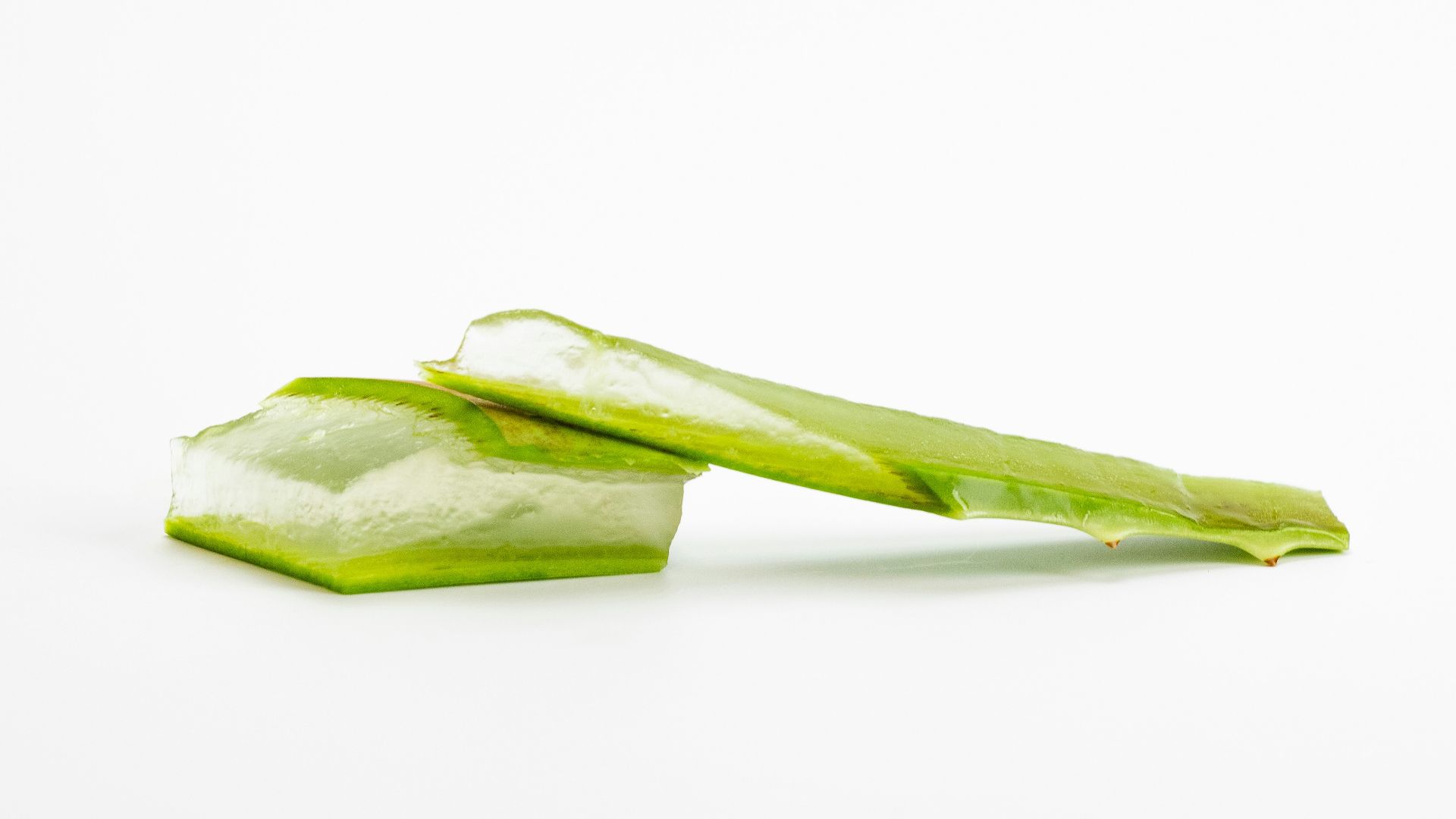 a piece of celery sitting on top of a white surface