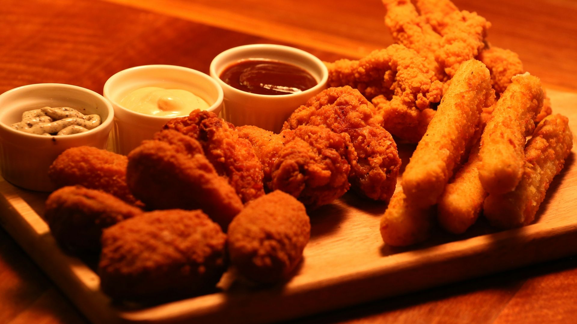 fried food on brown wooden tray