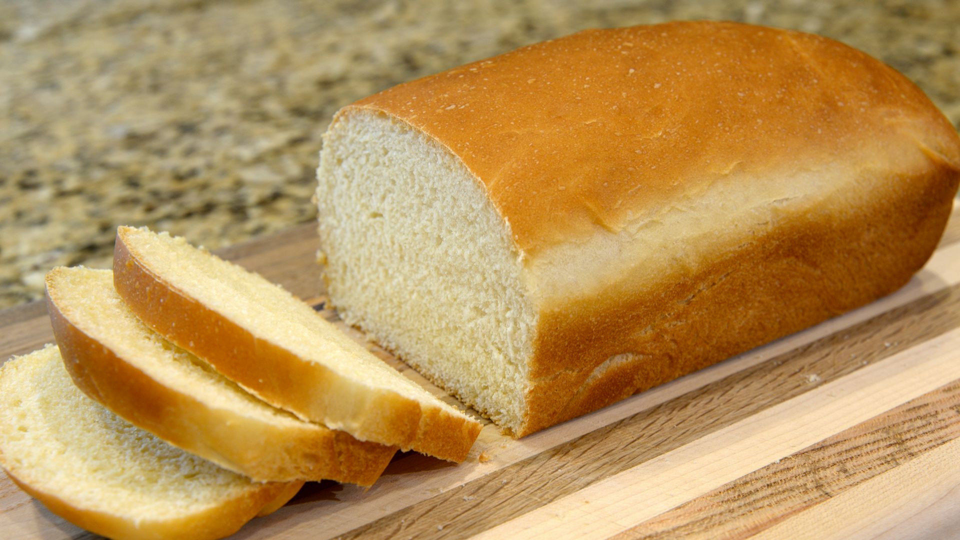 bread on brown wooden chopping board
