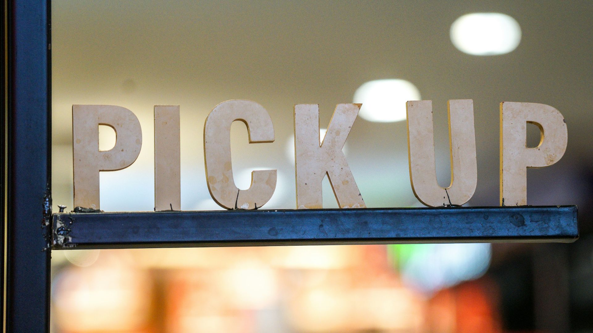 A close up of a sign that says pick up