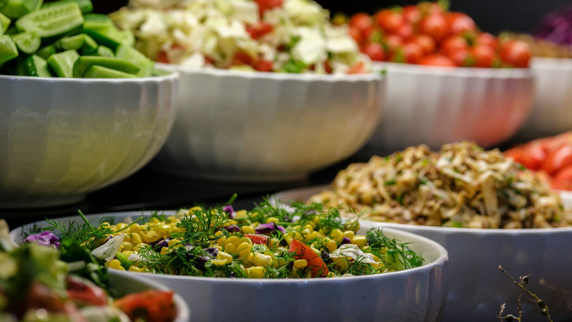 a group of bowls full of food