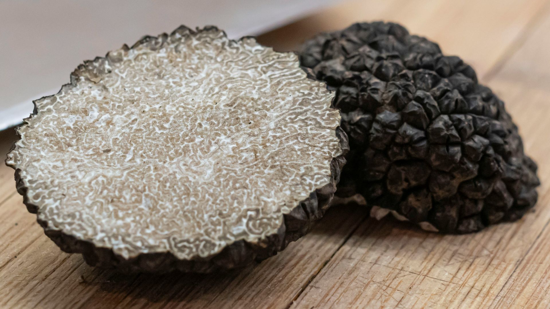 black and gray round ornament on brown wooden table