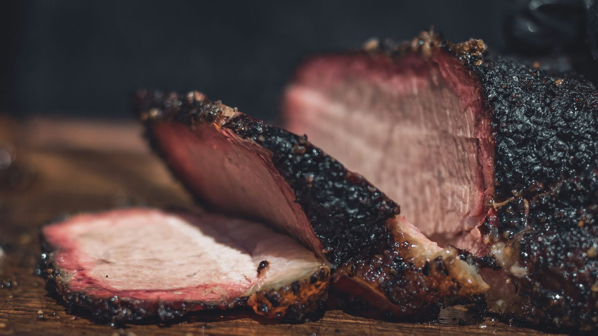 sliced meat on brown wooden chopping board