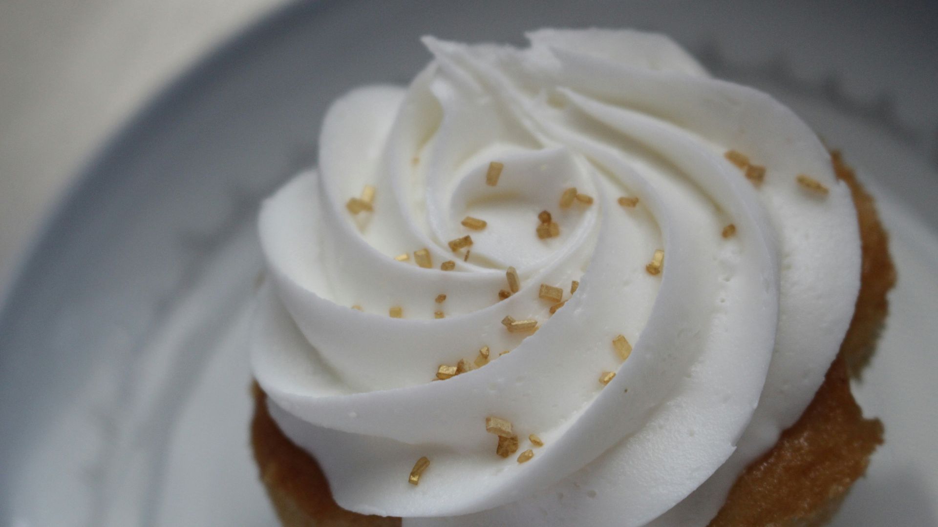 white icing covered cake on white ceramic plate
