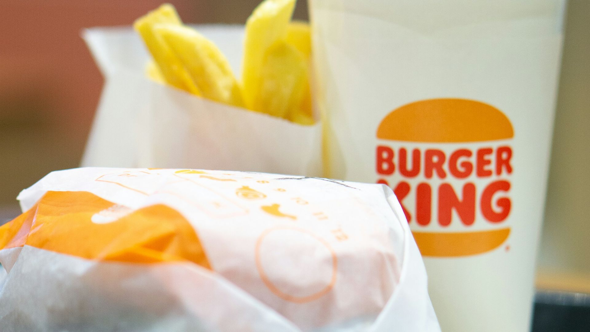 a plate with a sandwich and a cup of coffee