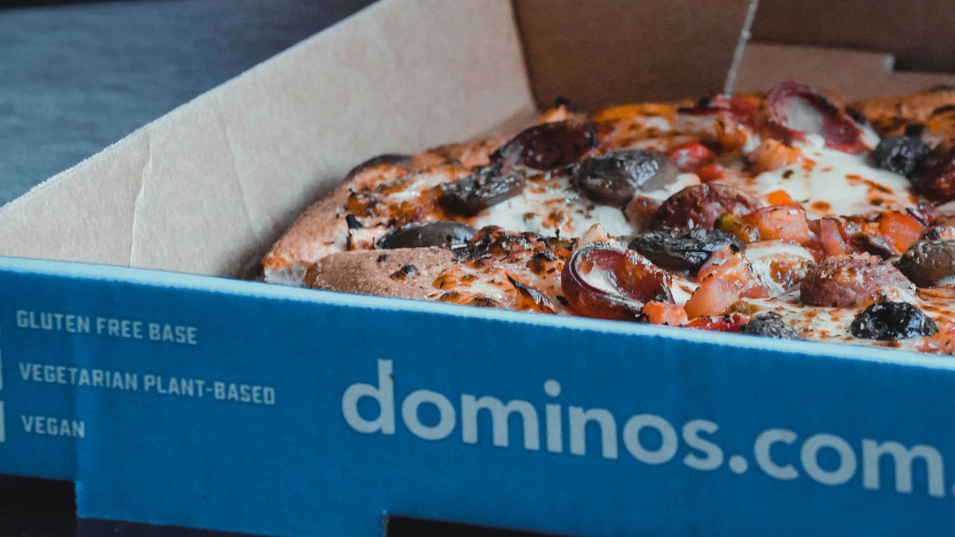 a blue box with a pizza inside of it