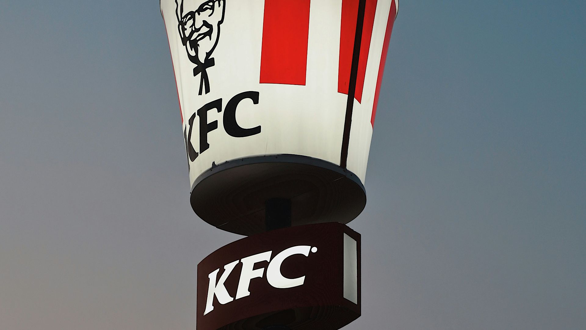 a kfc sign with a man's face on it