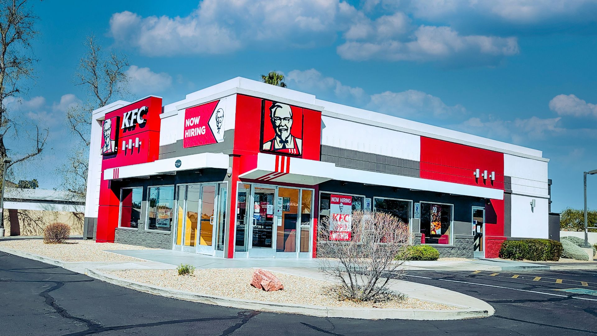 red and white concrete building under blue sky during daytime