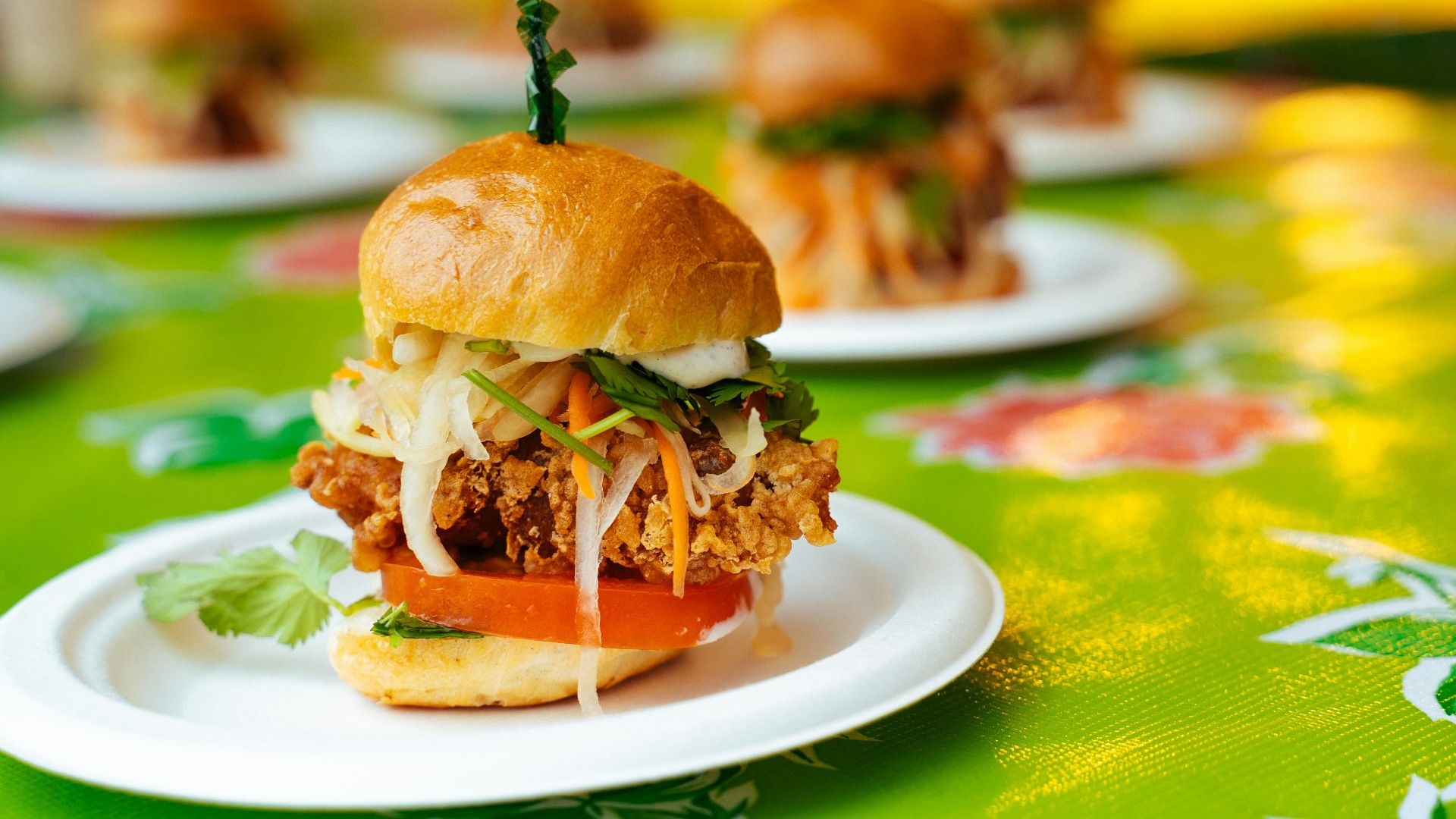 burger on white and green plate