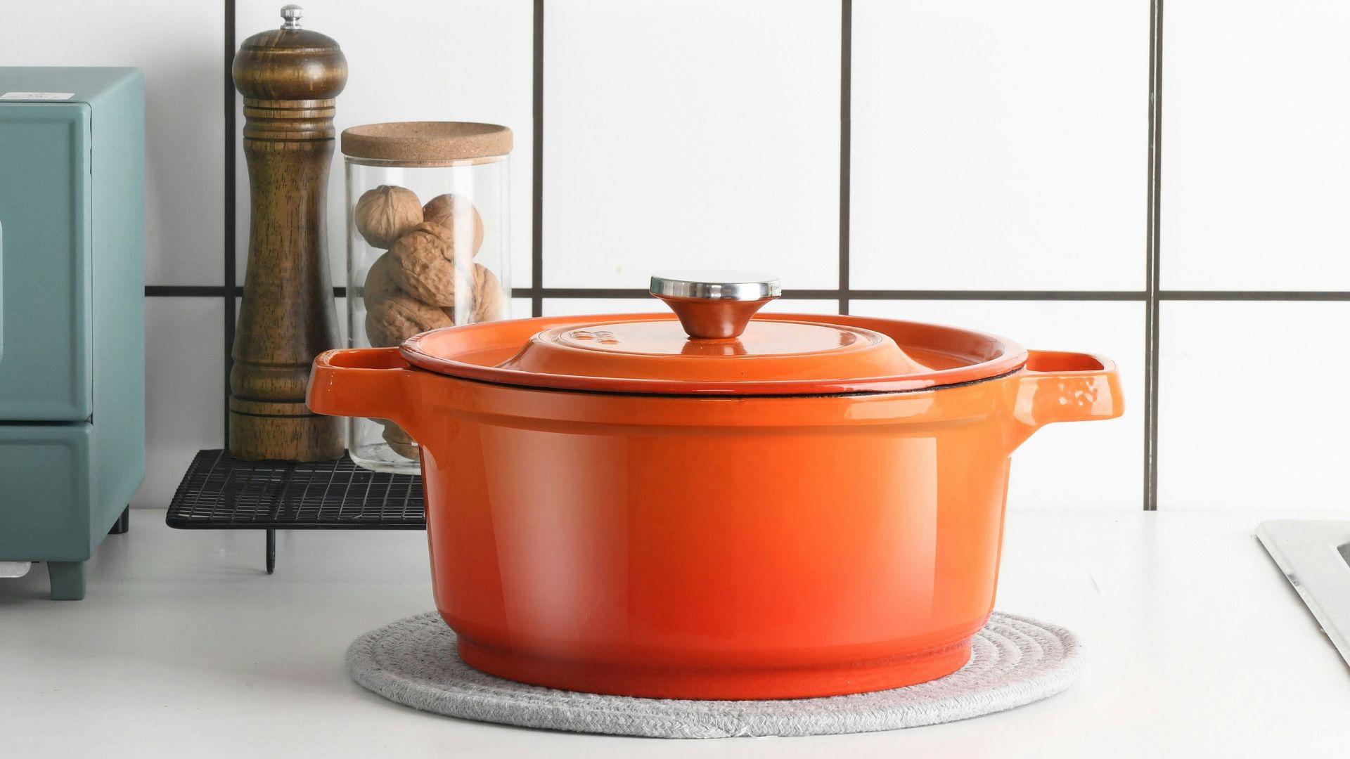 orange plastic container on white table