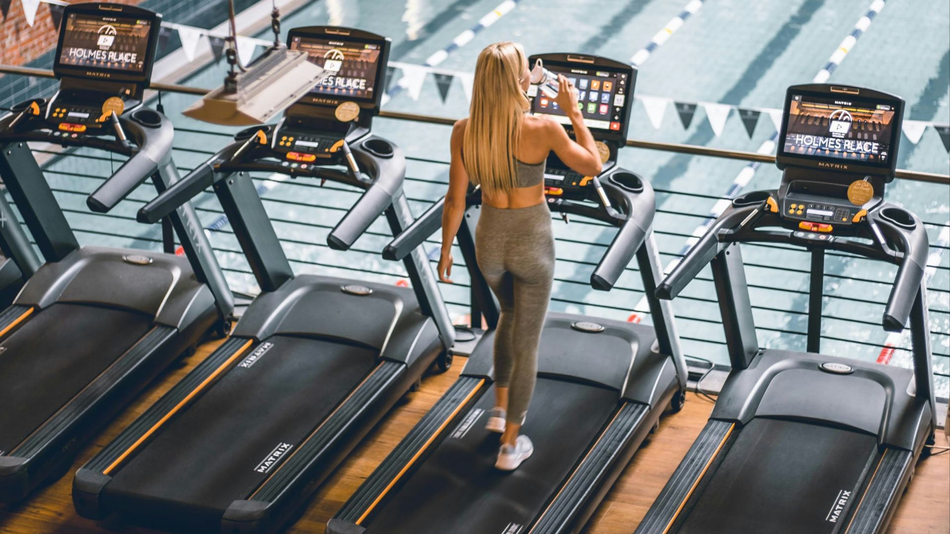 a person playing a guitar in a bowling alley