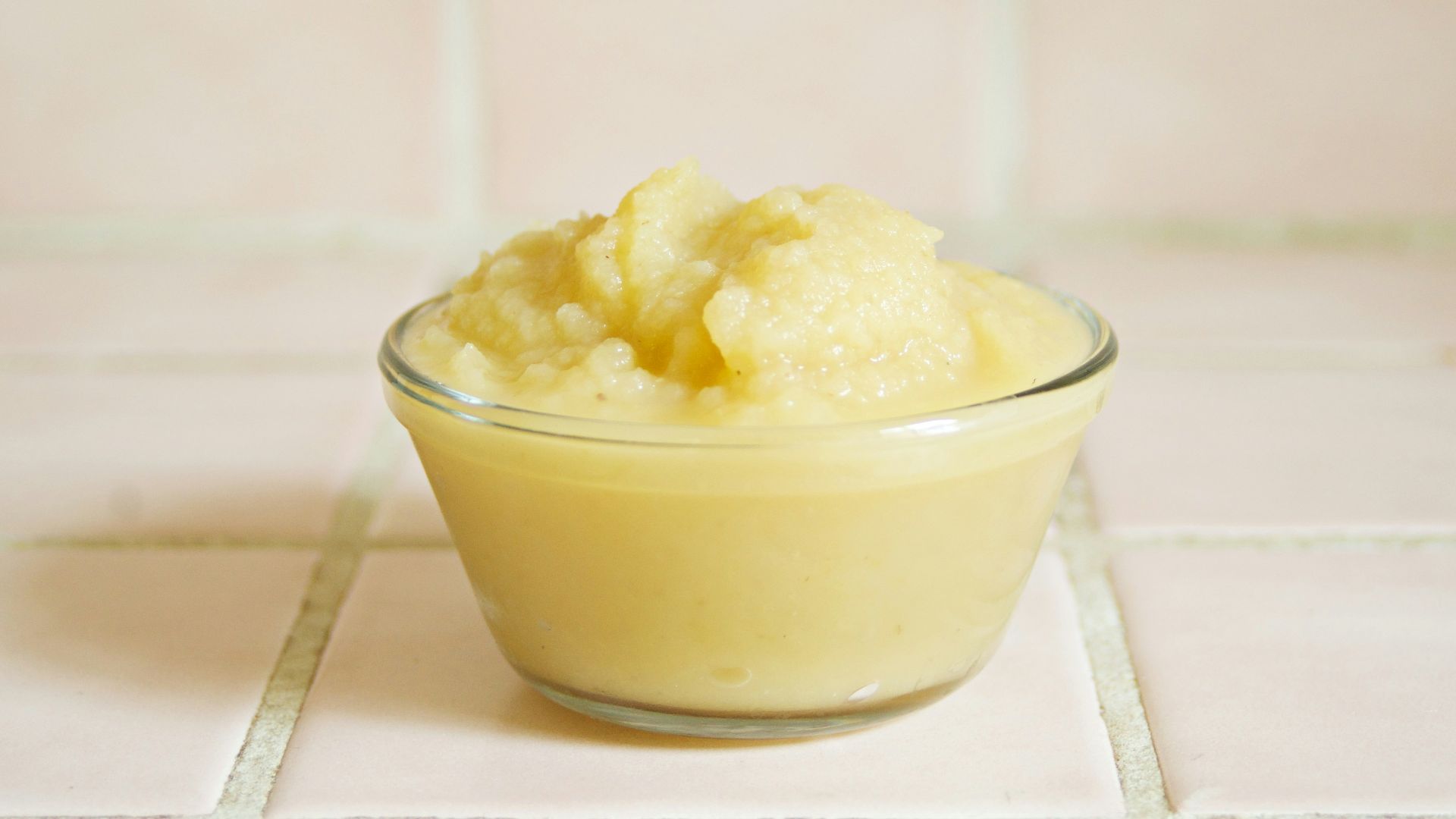yellow cream in clear glass bowl