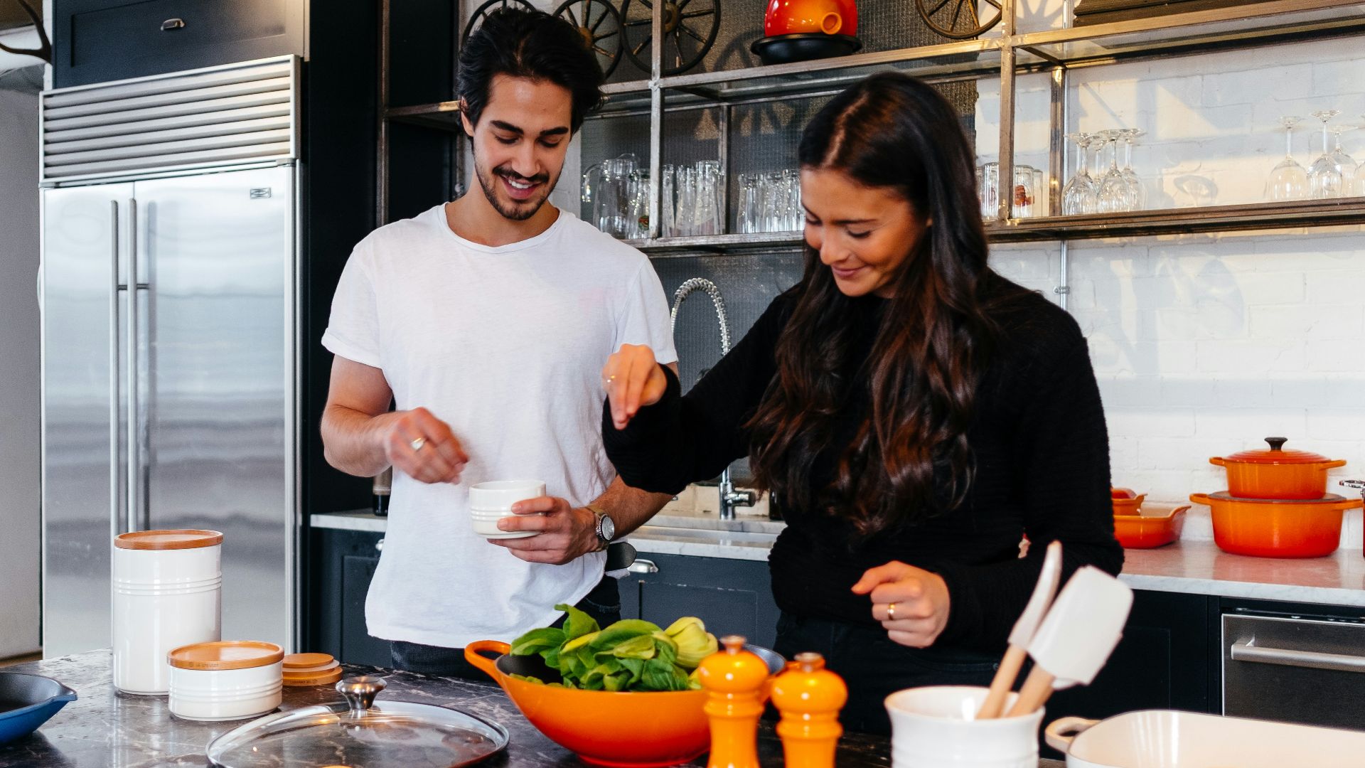 man and woman cooking