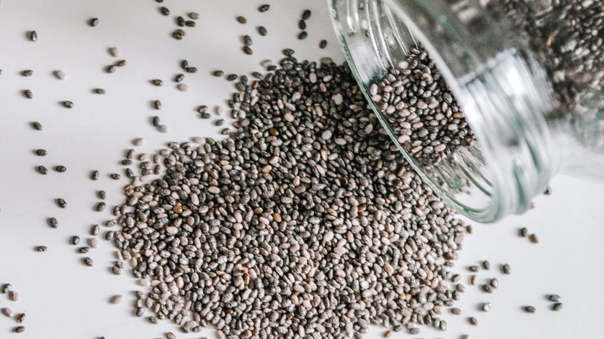 black beads in clear glass jar
