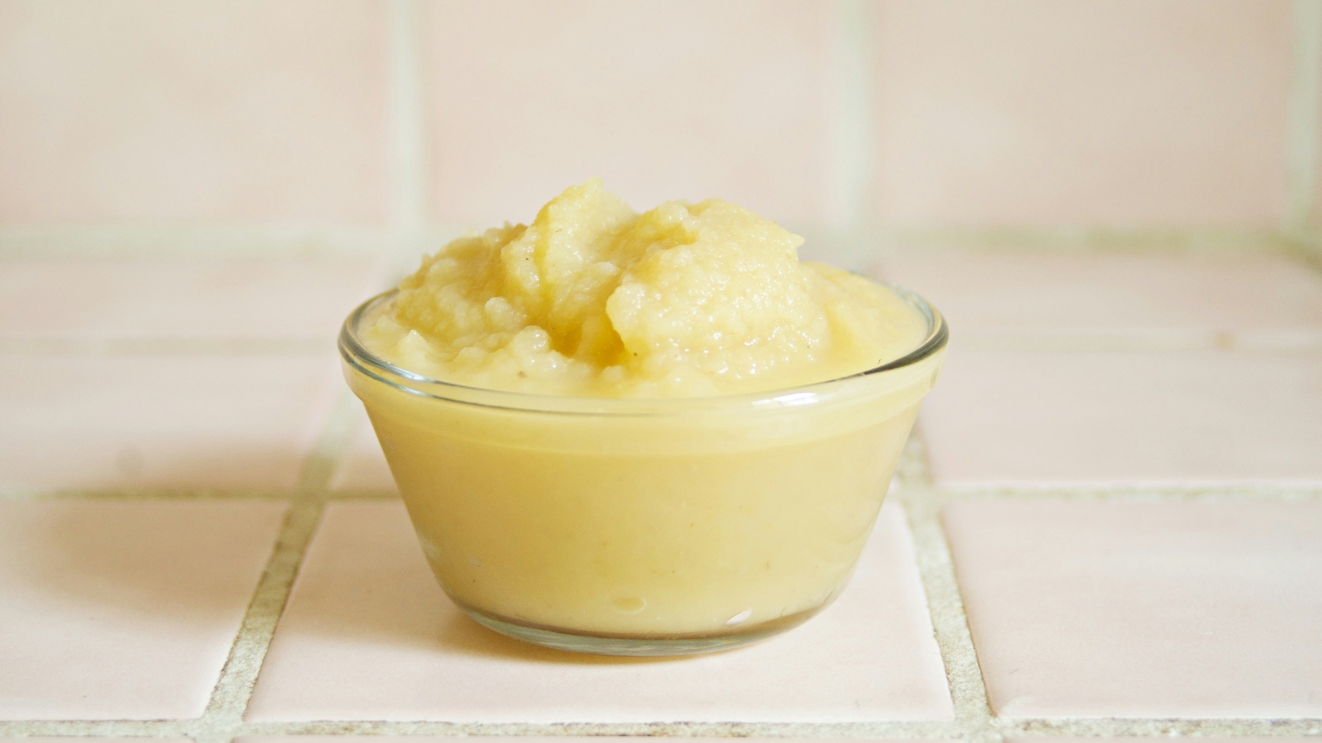 yellow cream in clear glass bowl