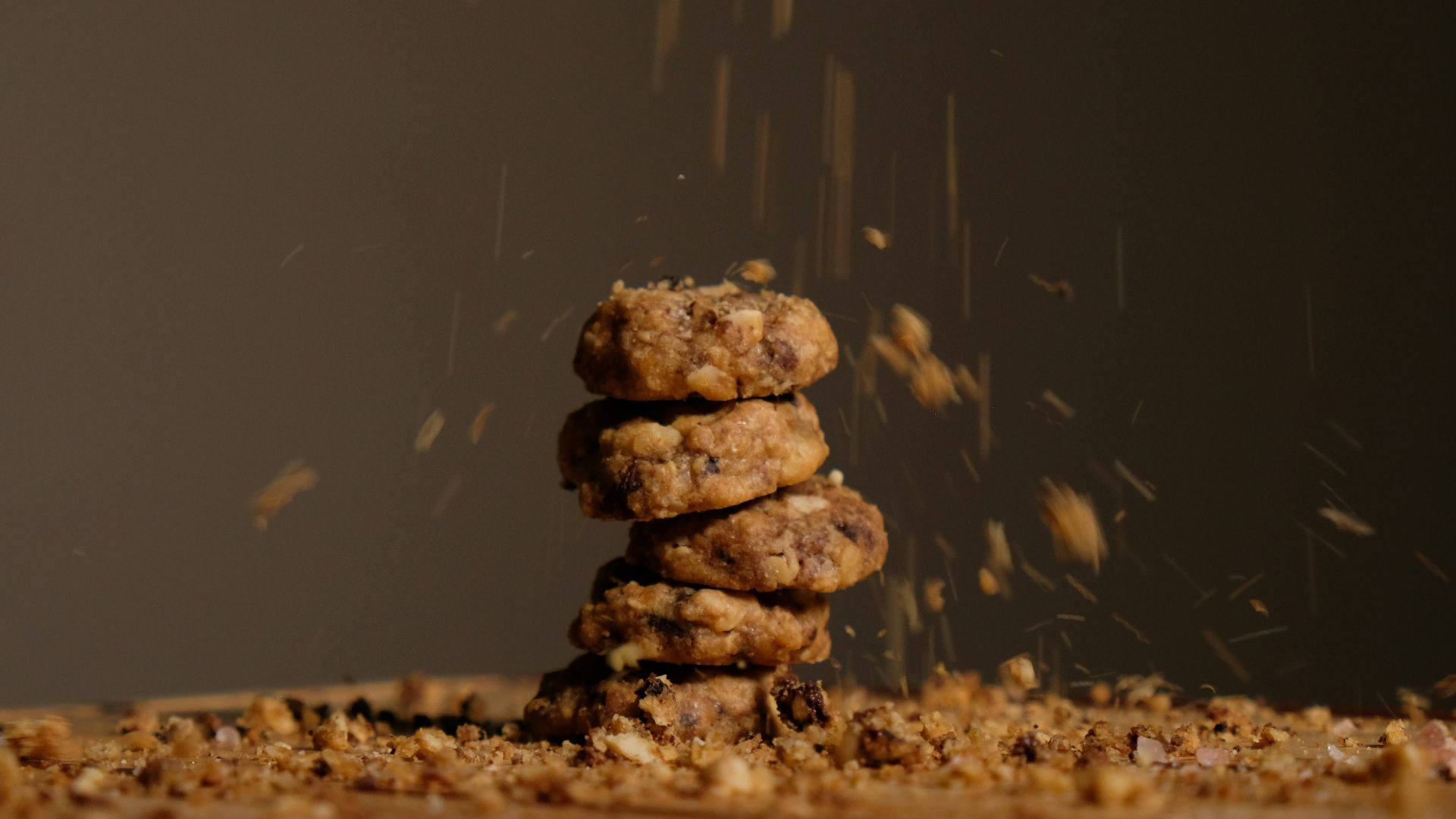 a stack of cookies sitting on top of a wooden table