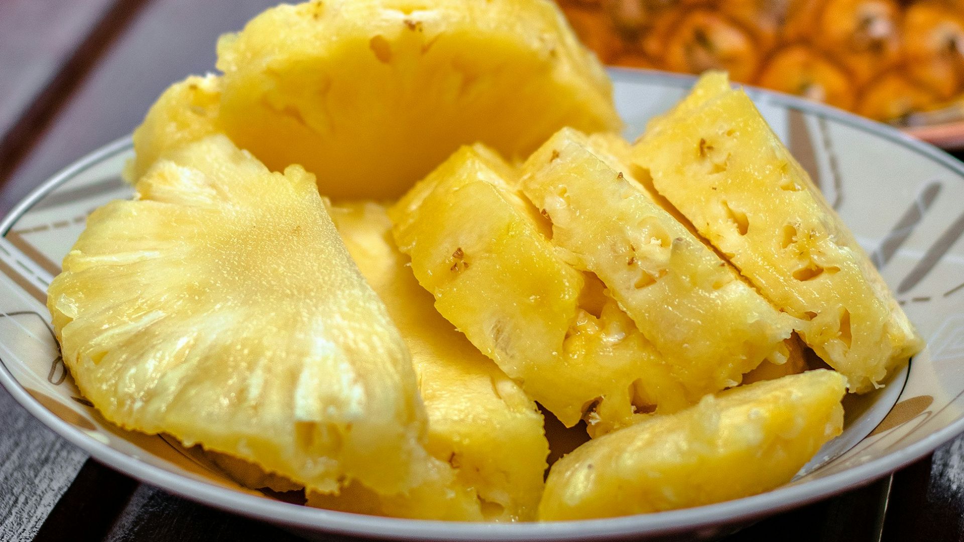 sliced pineapple on white ceramic plate