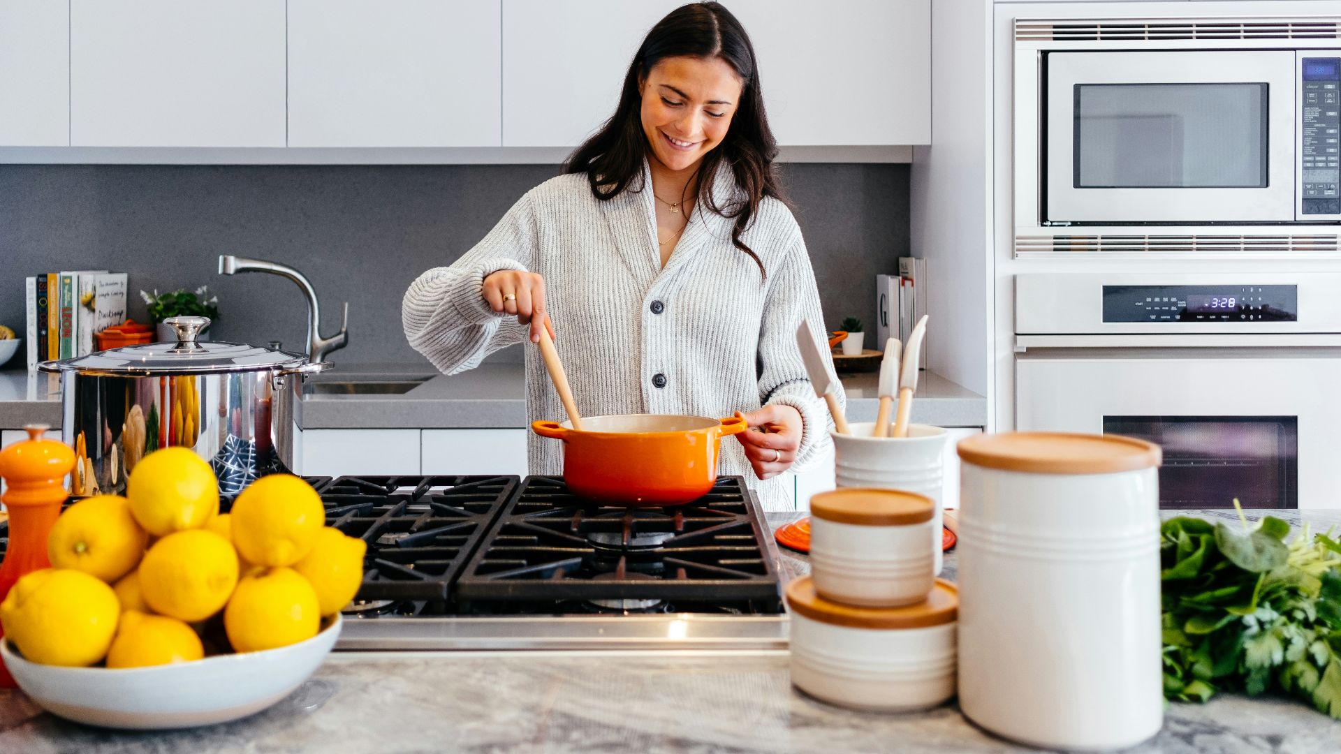 woman cooking inside kitchen room