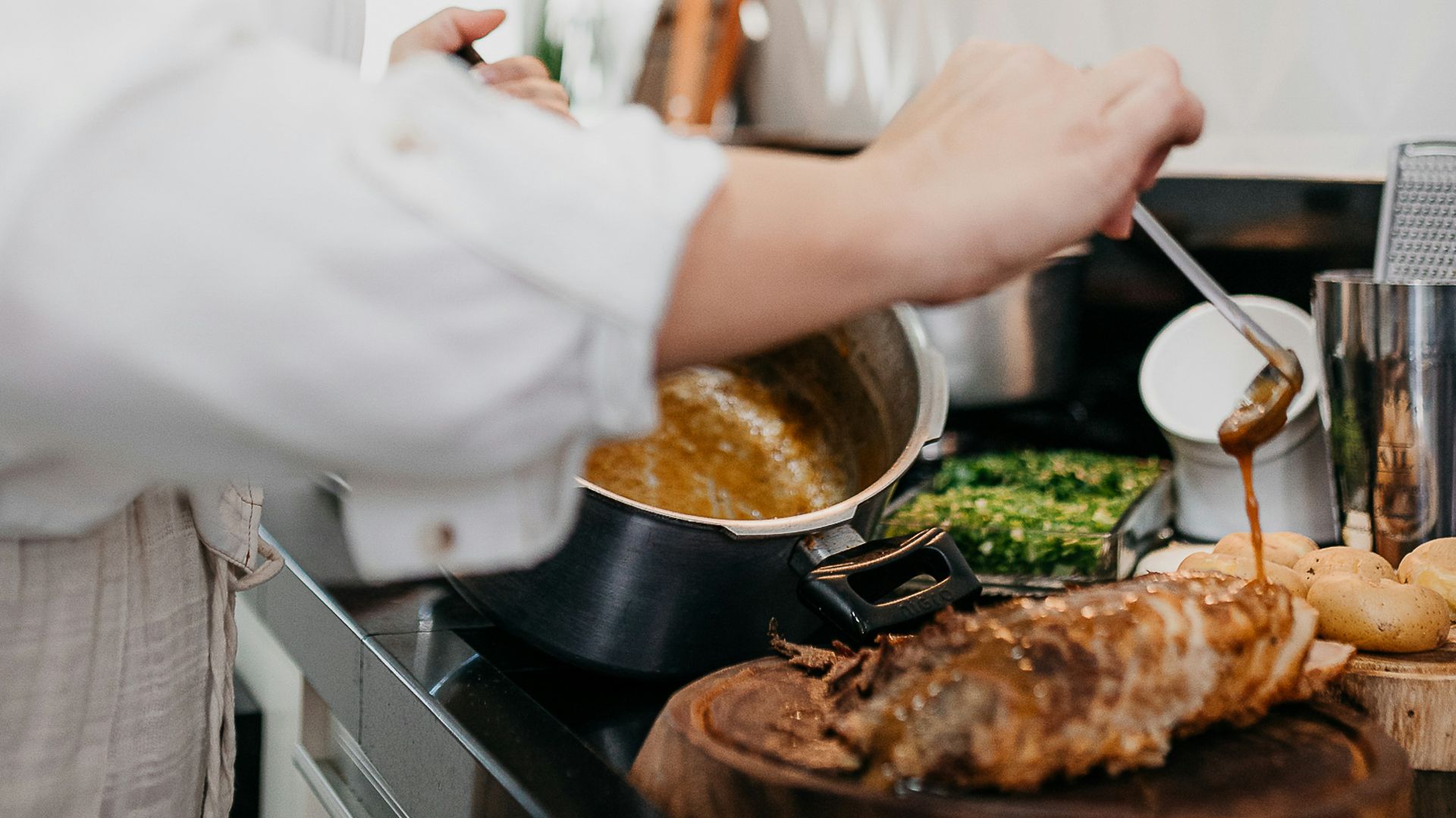 woman in white long sleeve shirt holding silver fork