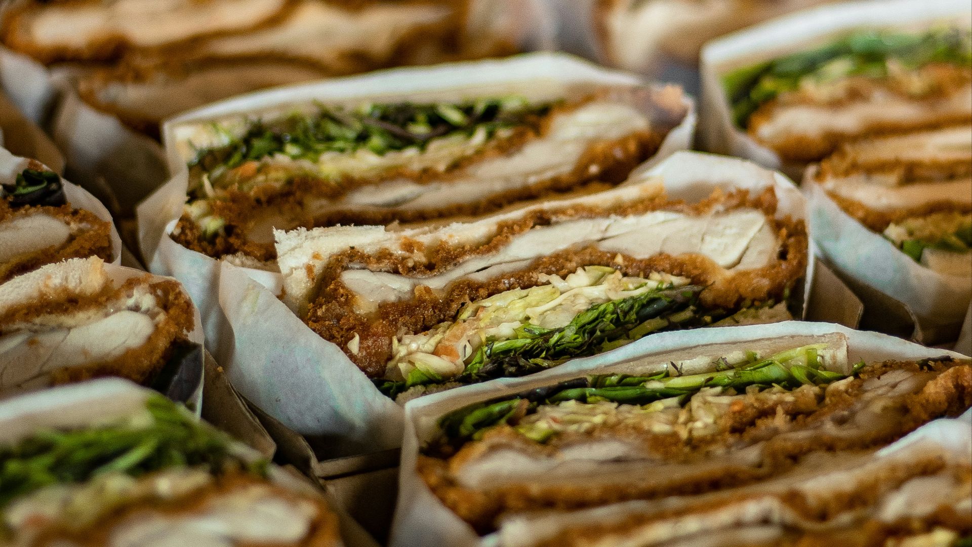 a close up of a tray of sandwiches