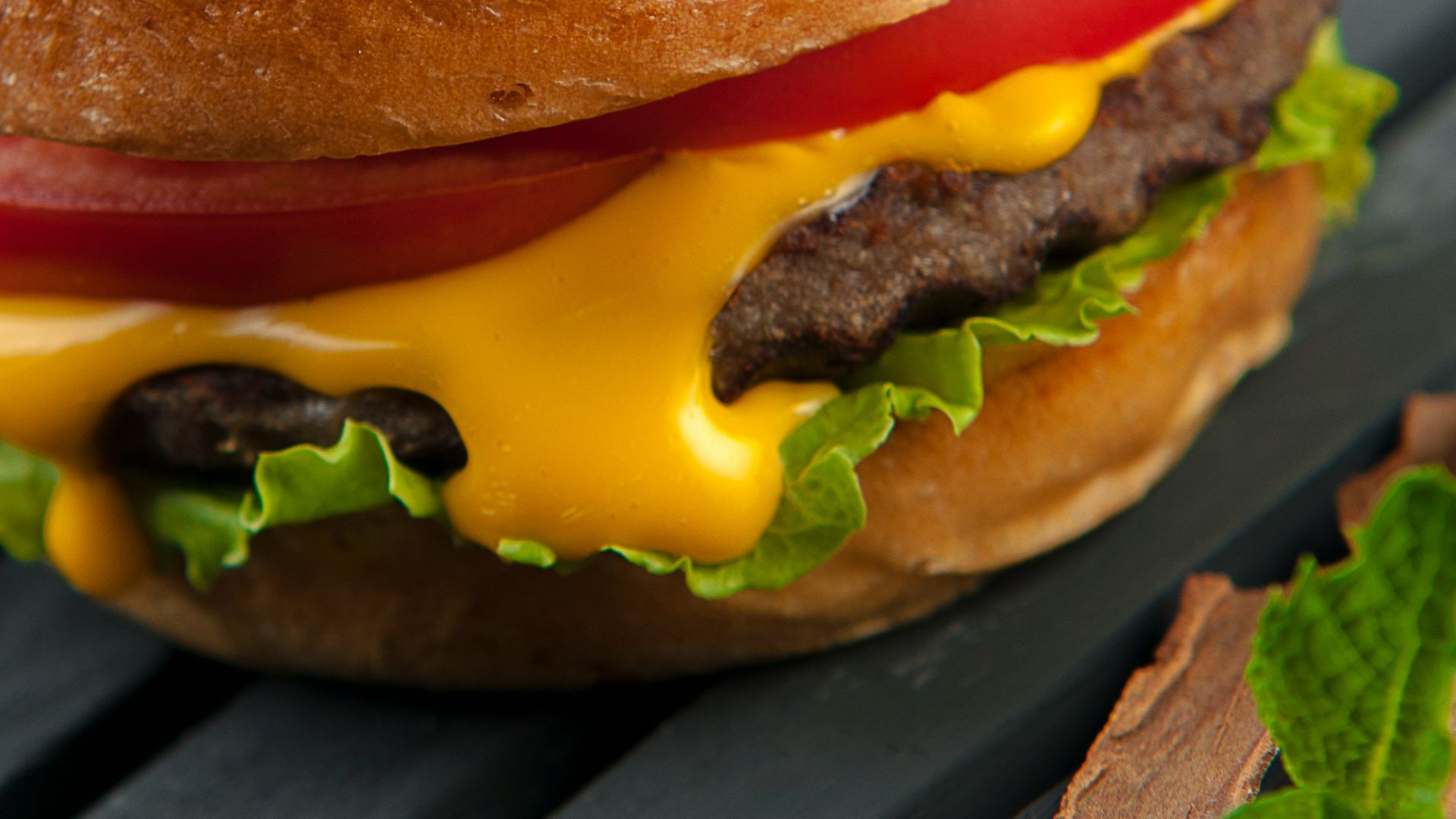 cheese burger on a wooden surface