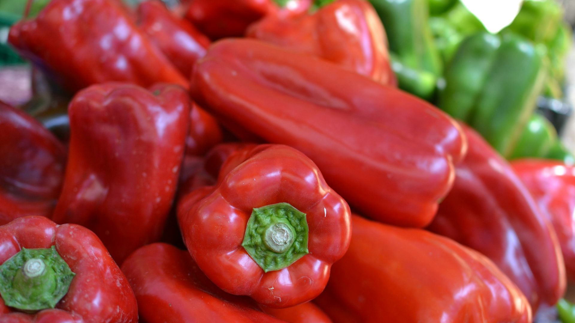 red bell pepper on brown wooden table