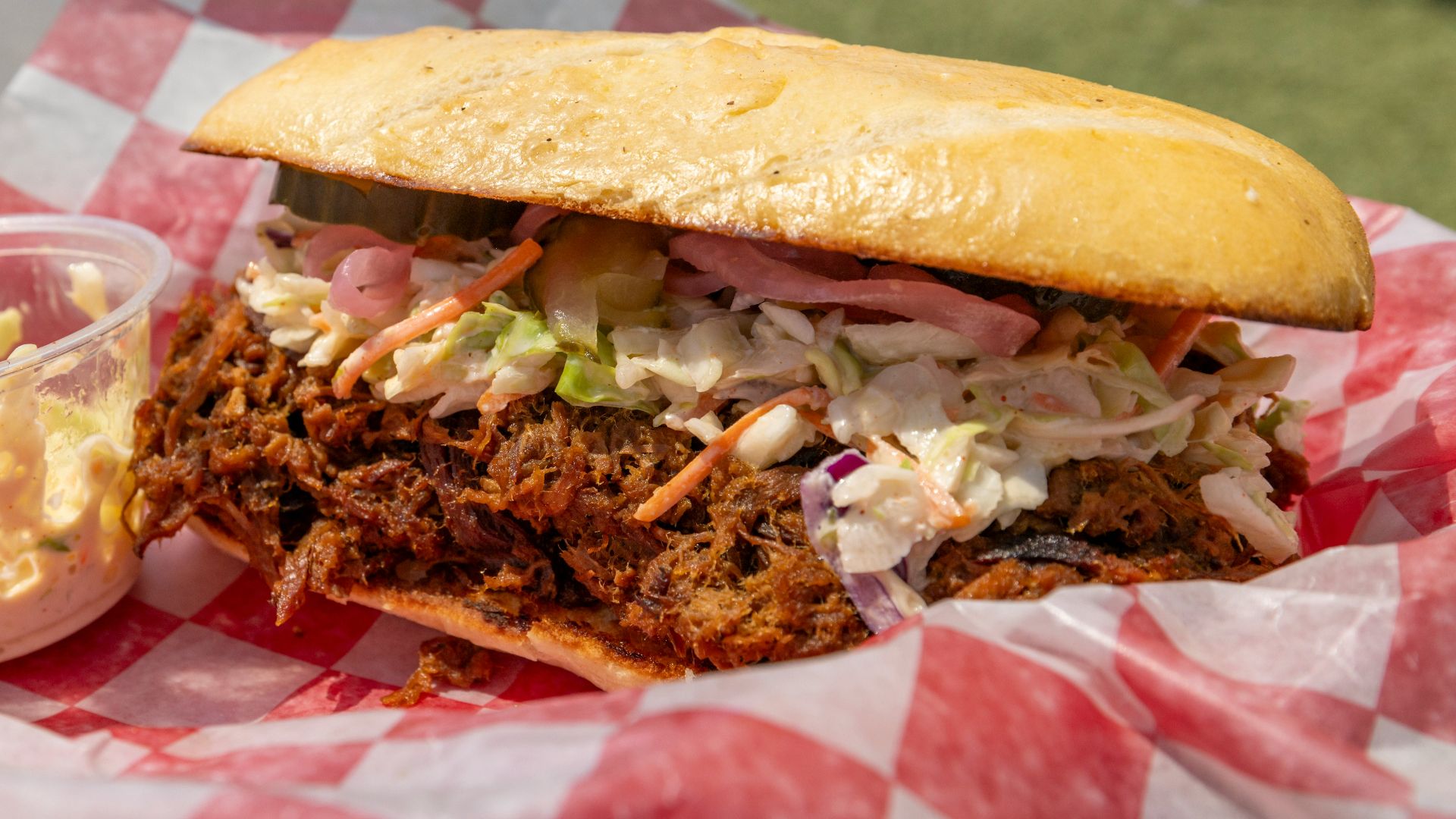 Pulled pork sandwich with coleslaw and pickles