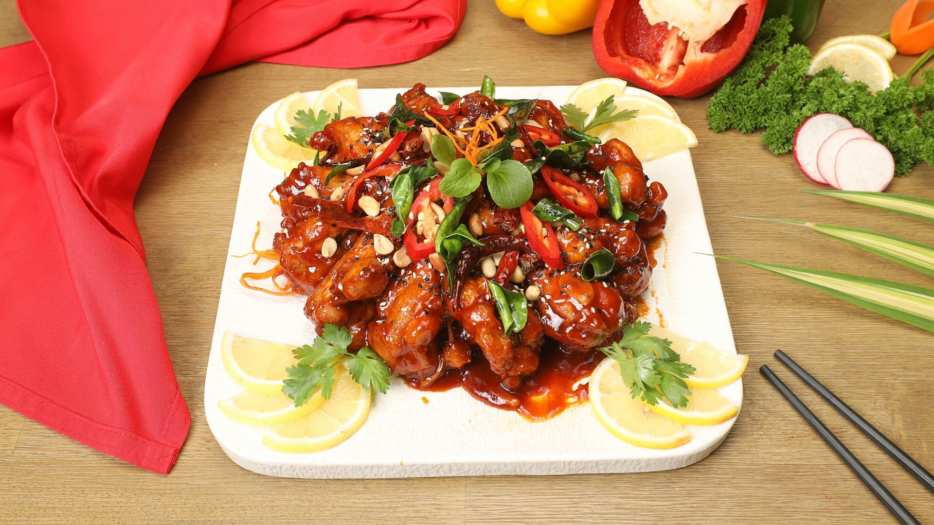 a white plate topped with meat covered in sauce