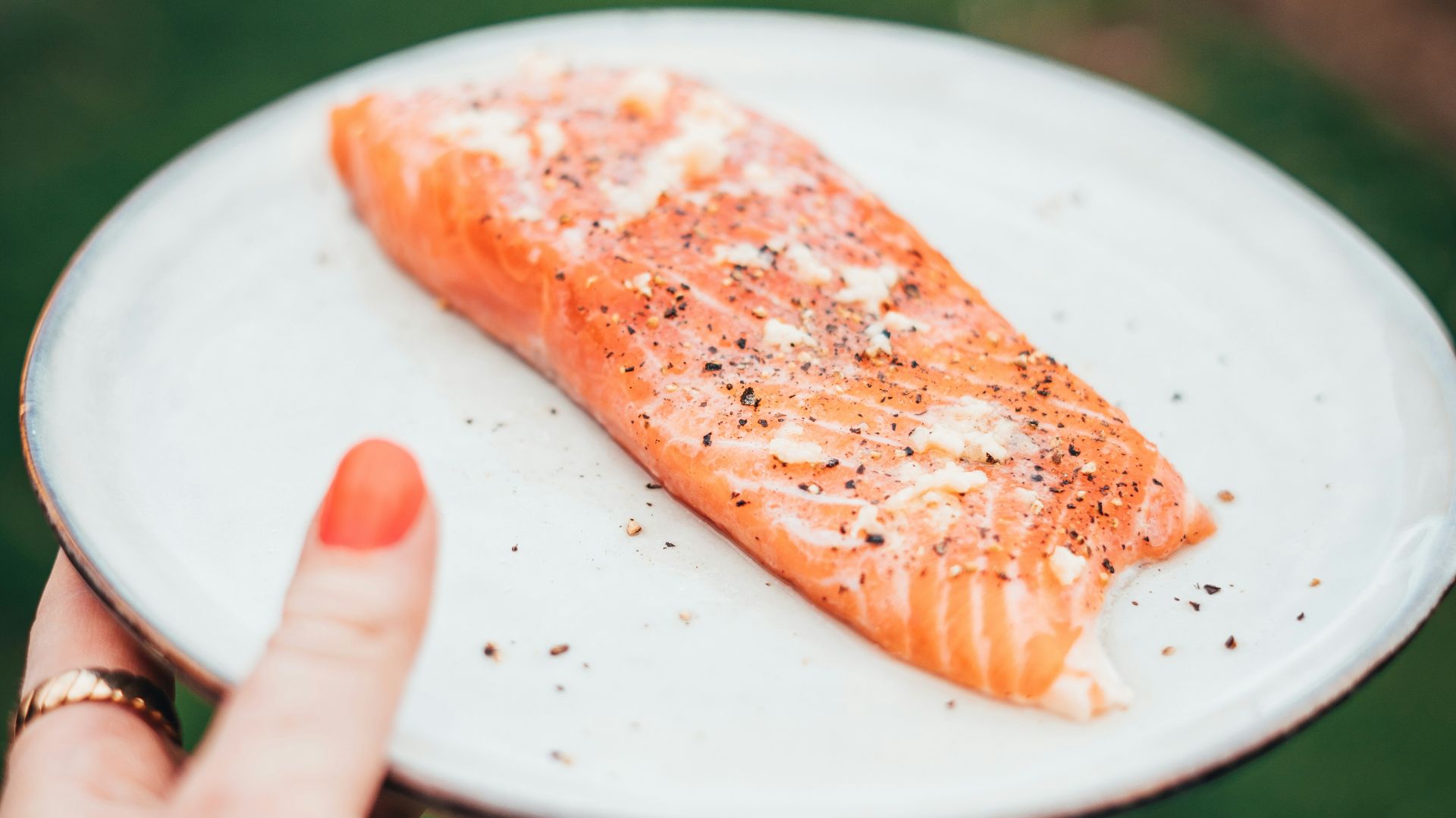 a person holding a plate of food