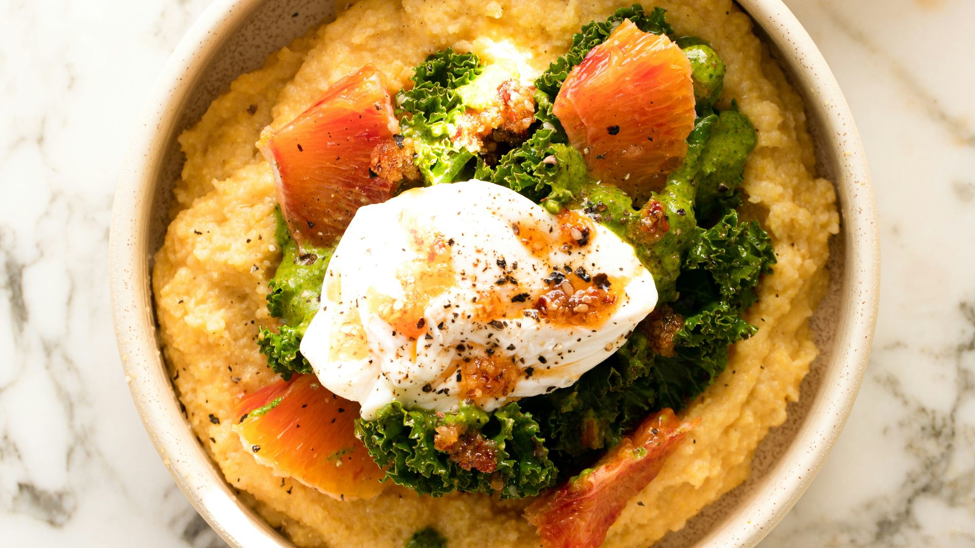 two bowls of food on a marble table