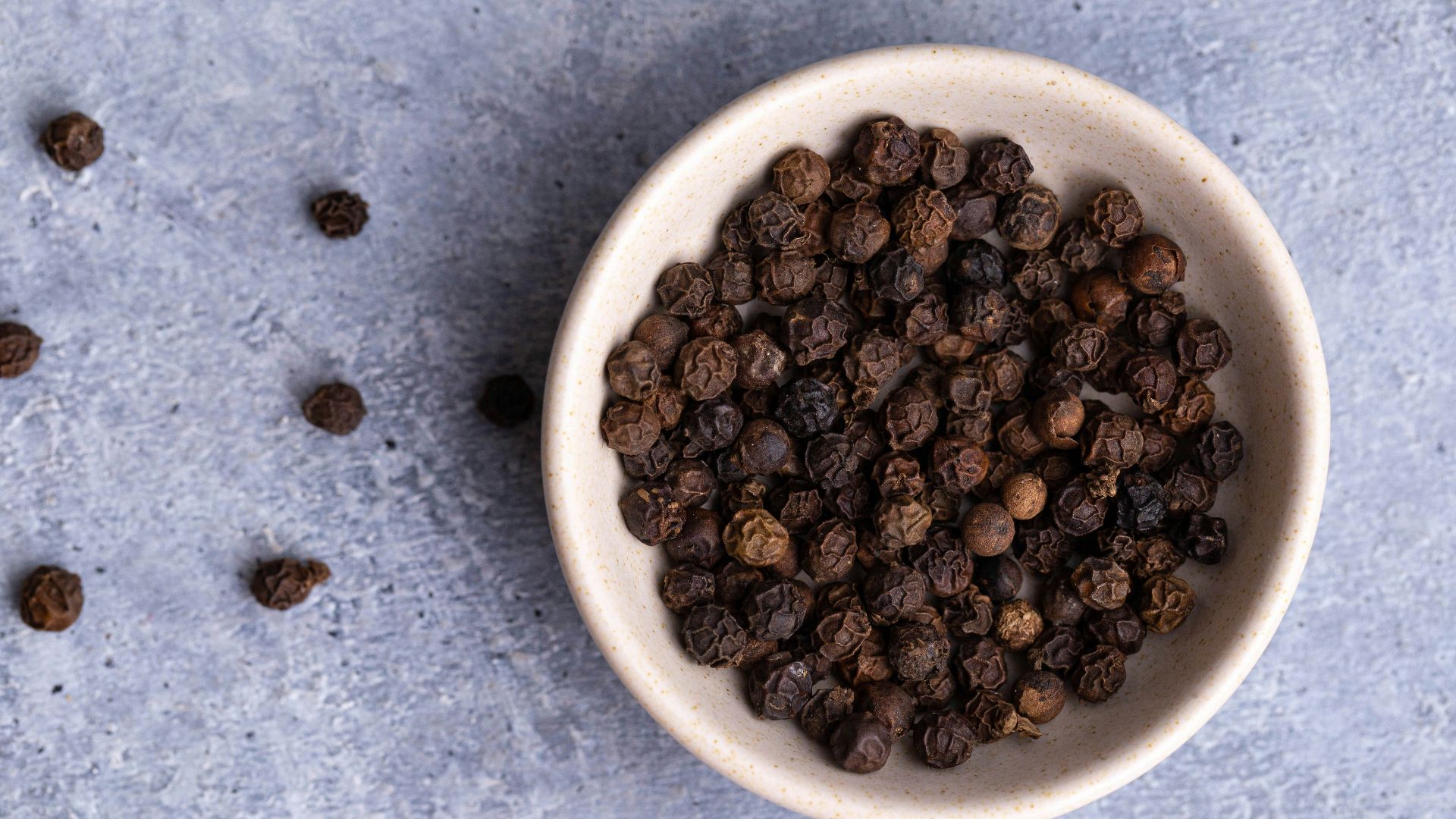brown coffee beans on white ceramic bowl