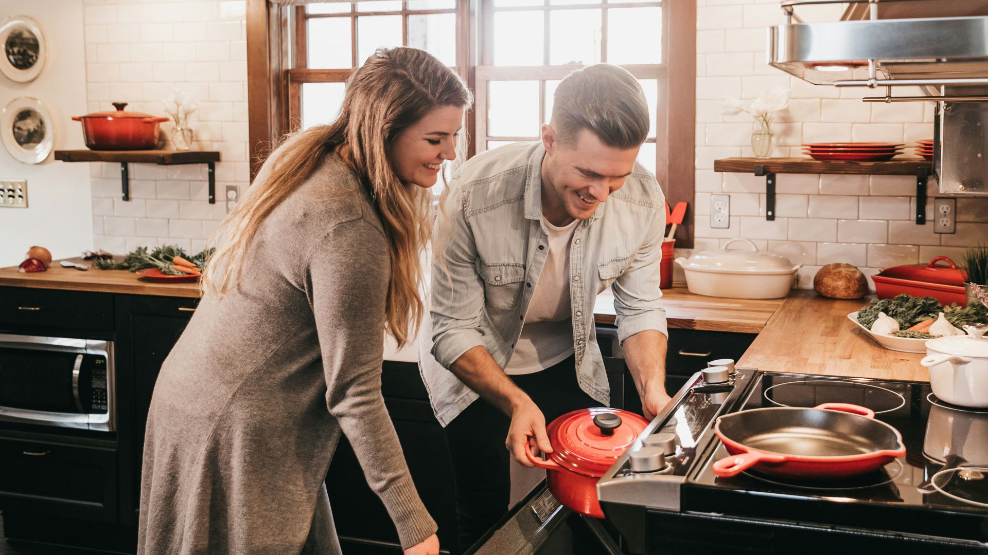man and woman cooking