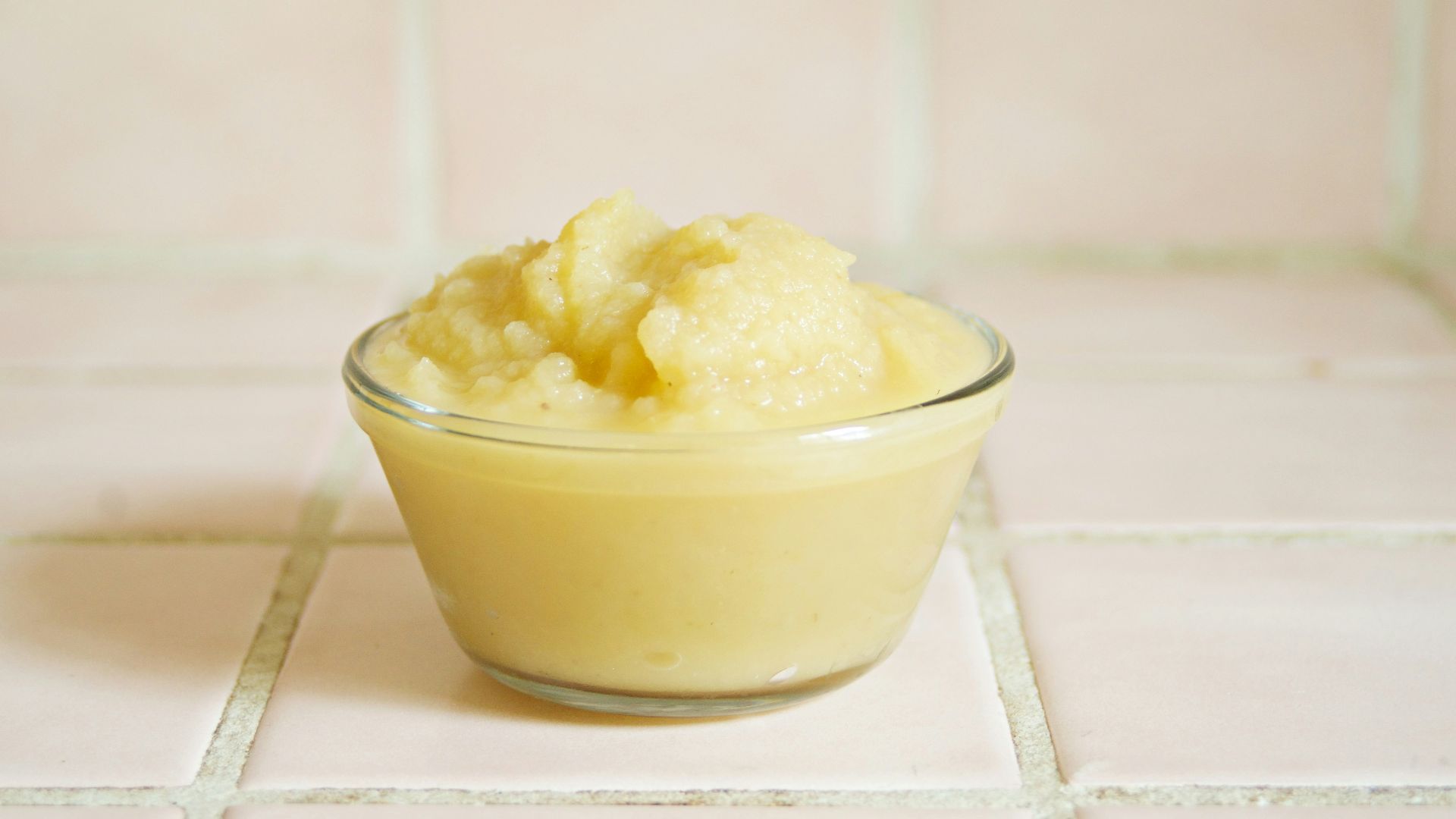 yellow cream in clear glass bowl