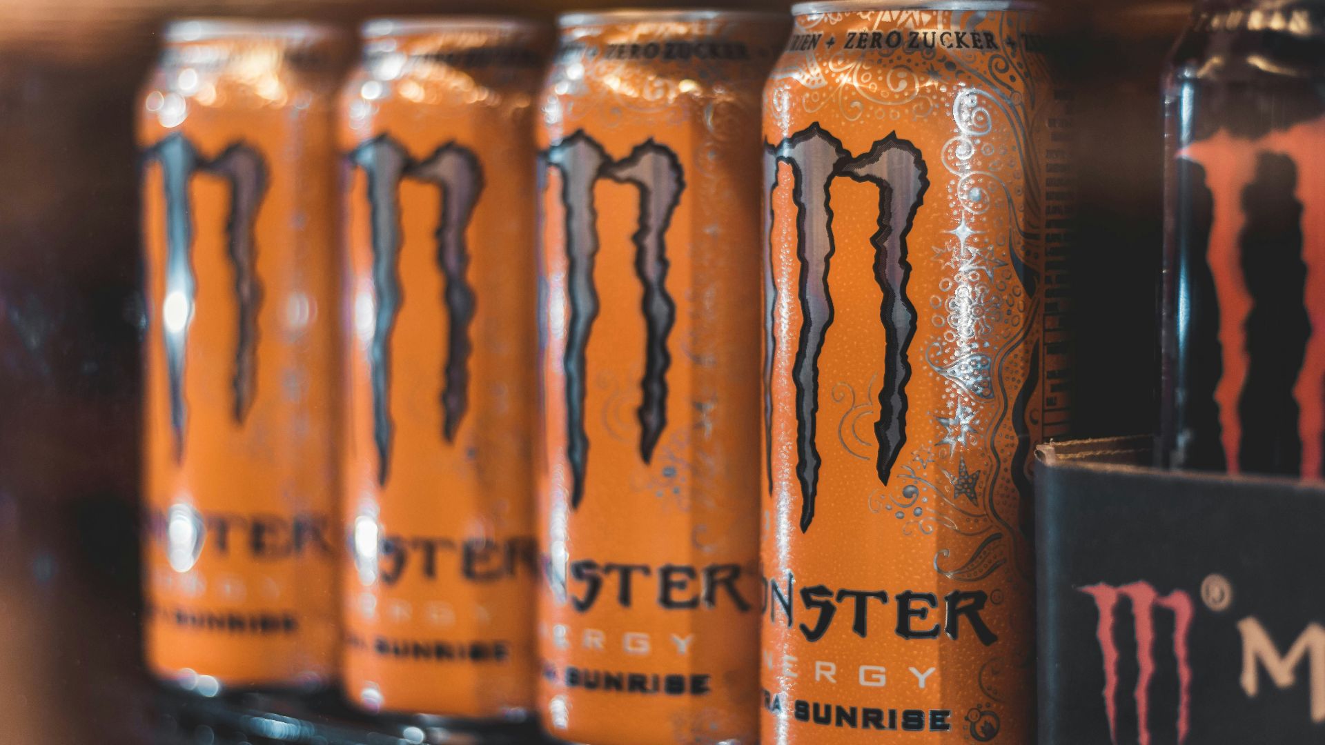 five Monster Energy cans