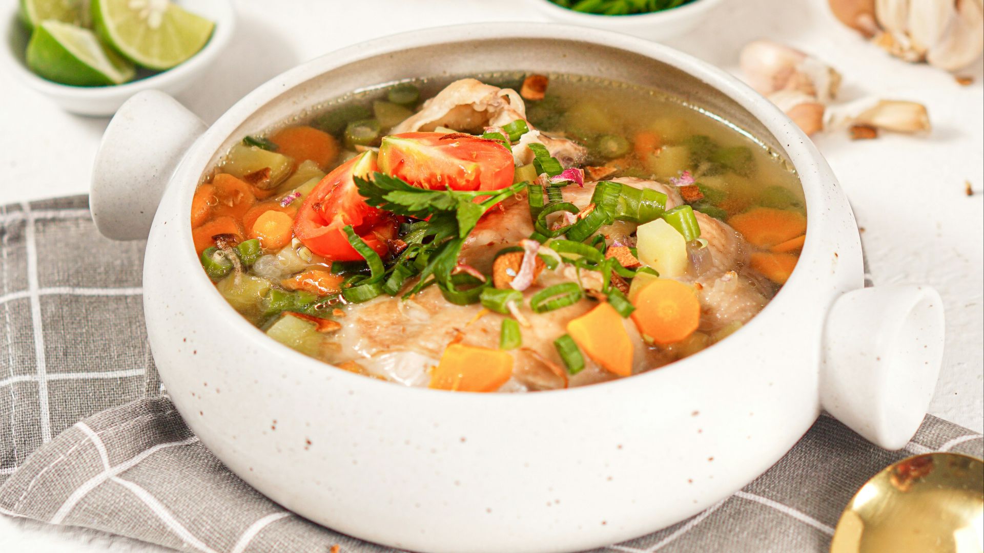 a bowl of soup is sitting on a table