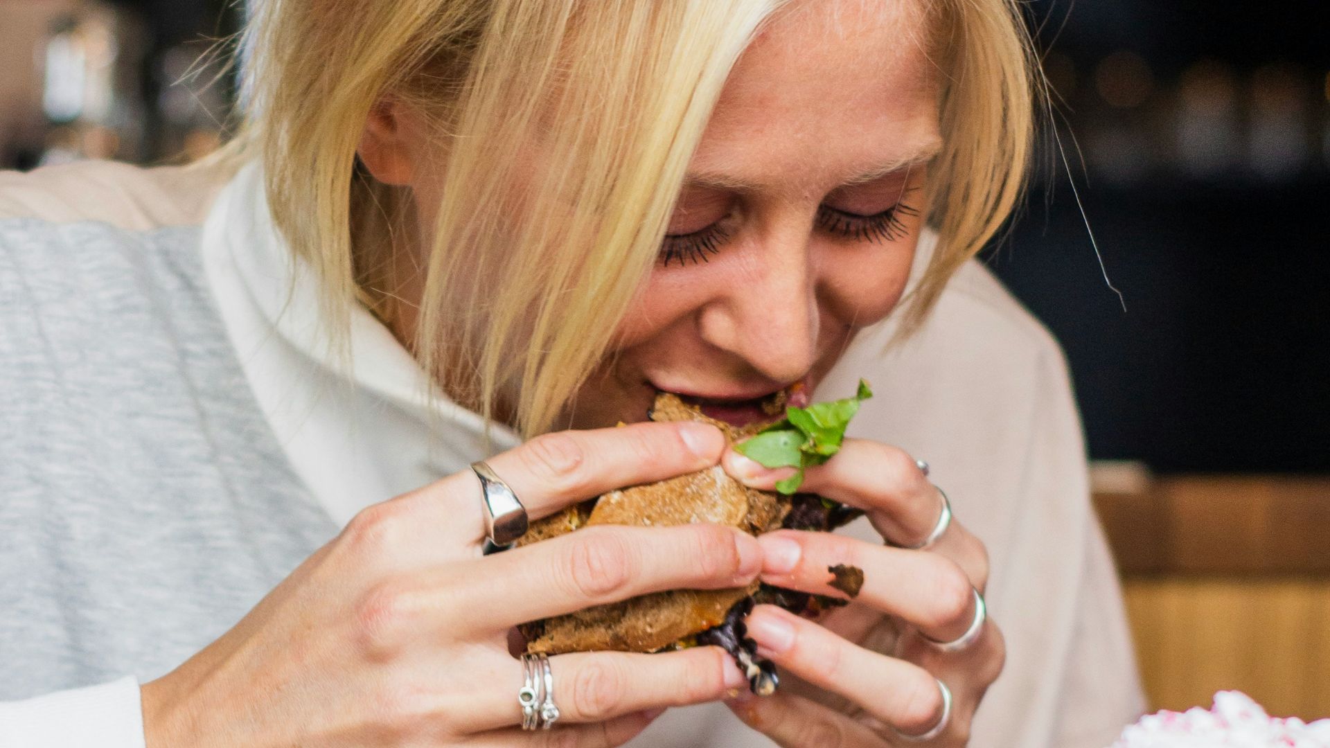 woman eating burger