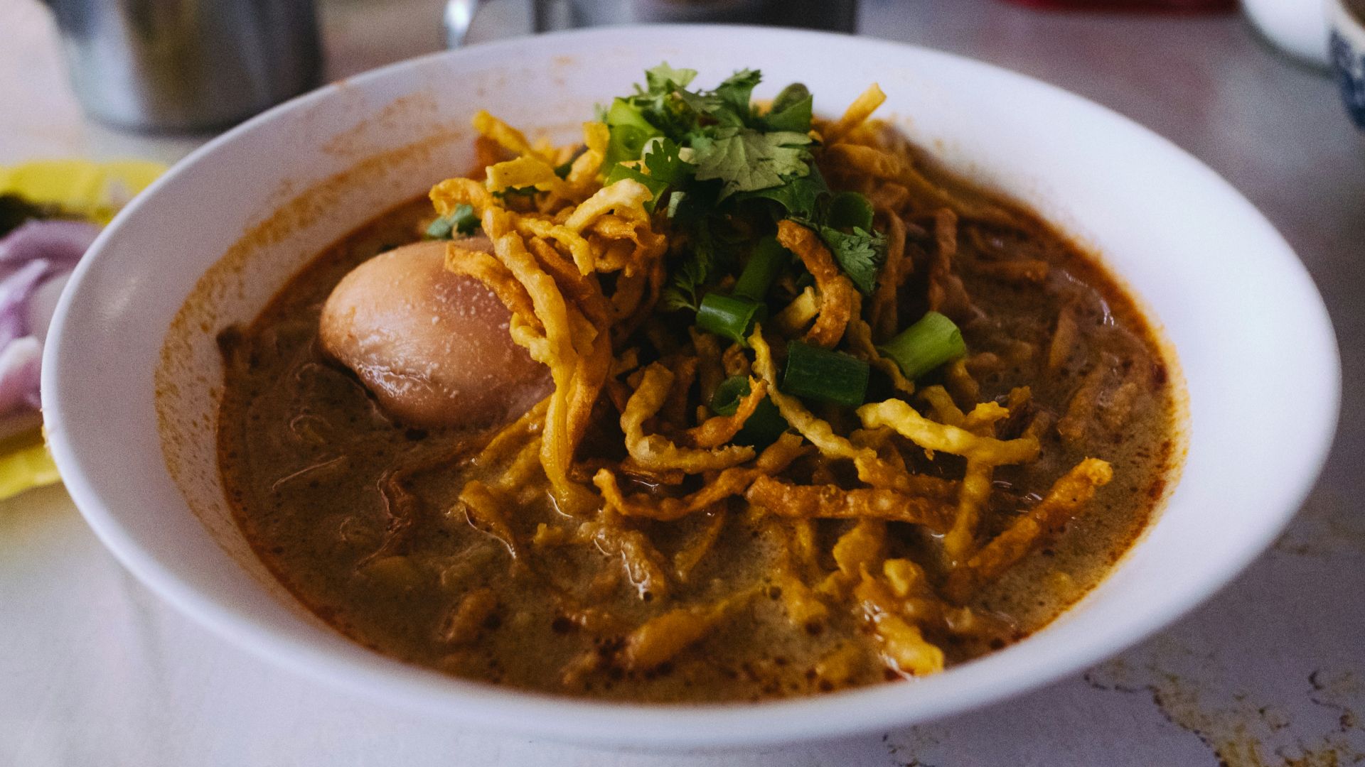 pasta soup with vegetable leaves in bowl