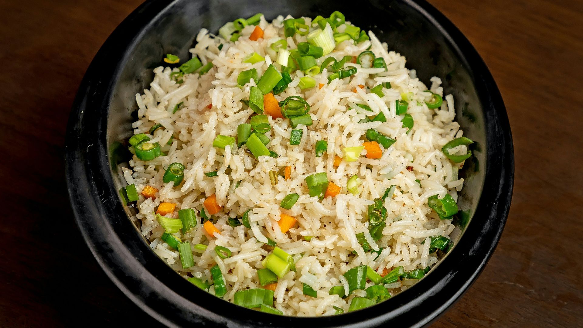 a bowl of rice with vegetables
