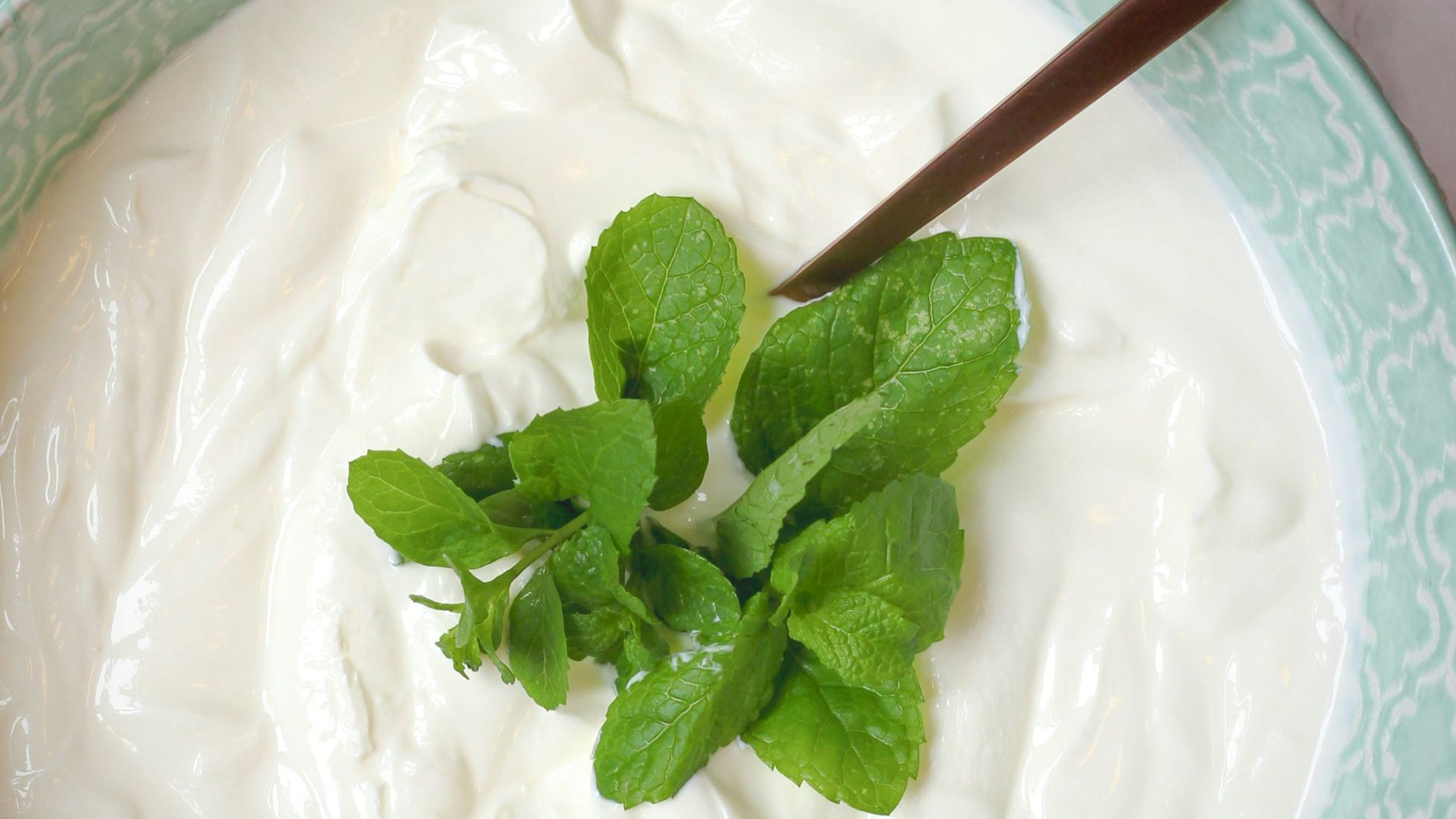 a bowl of yogurt with a spoon in it