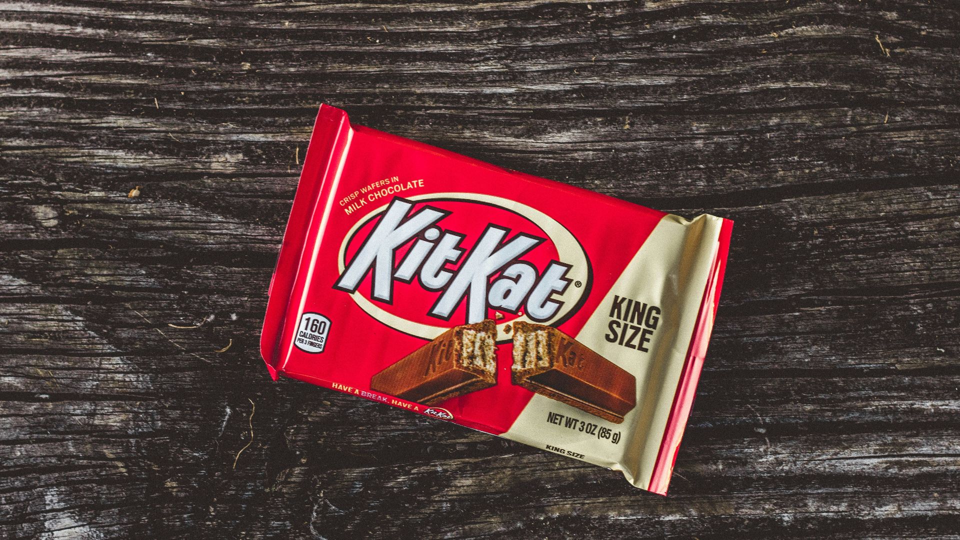 kitkat chocolate pack on black textile